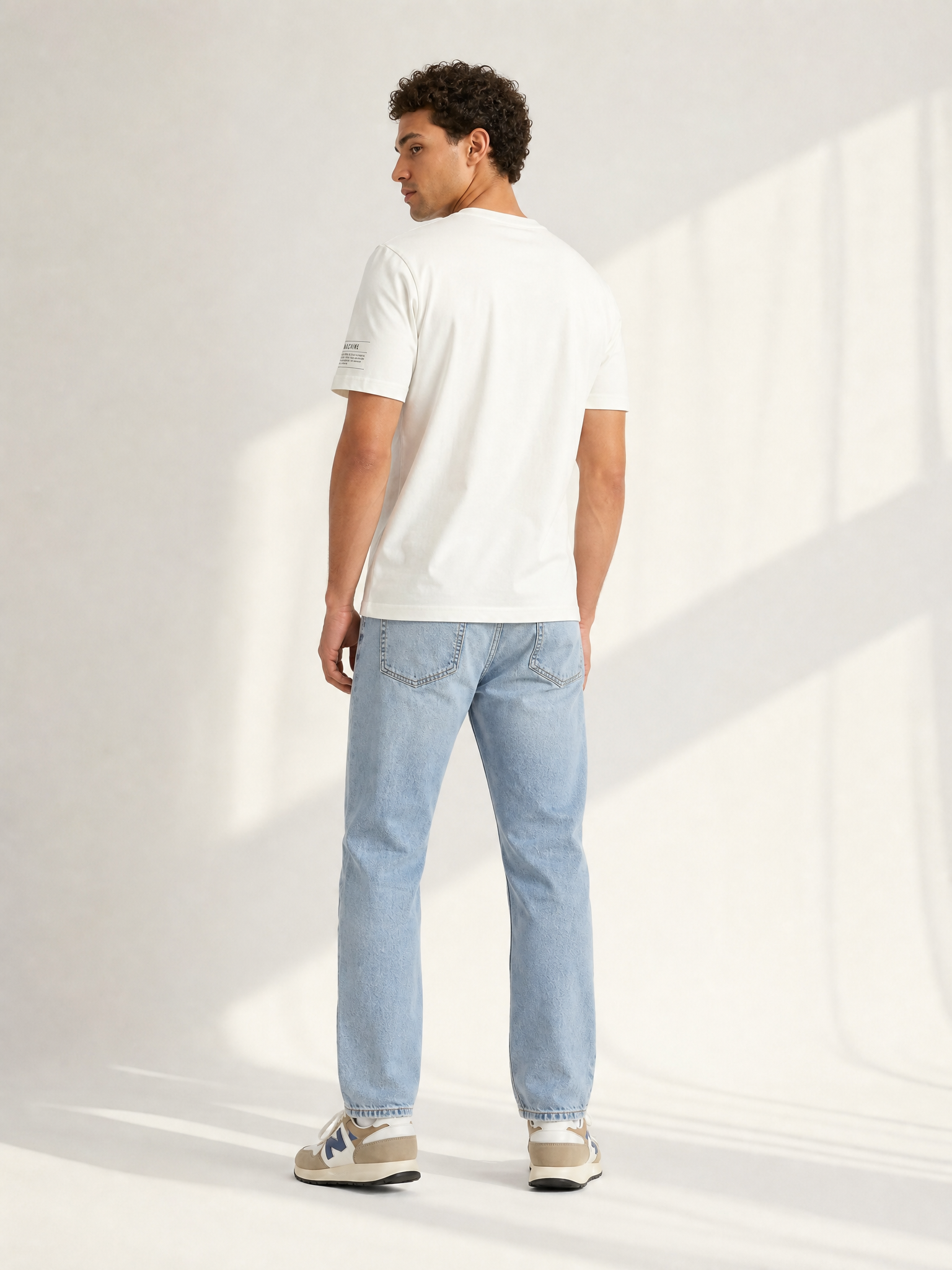 Back view of the Pedaleur de Charme - T-shirt - Off White by La Machine Cycle Club.