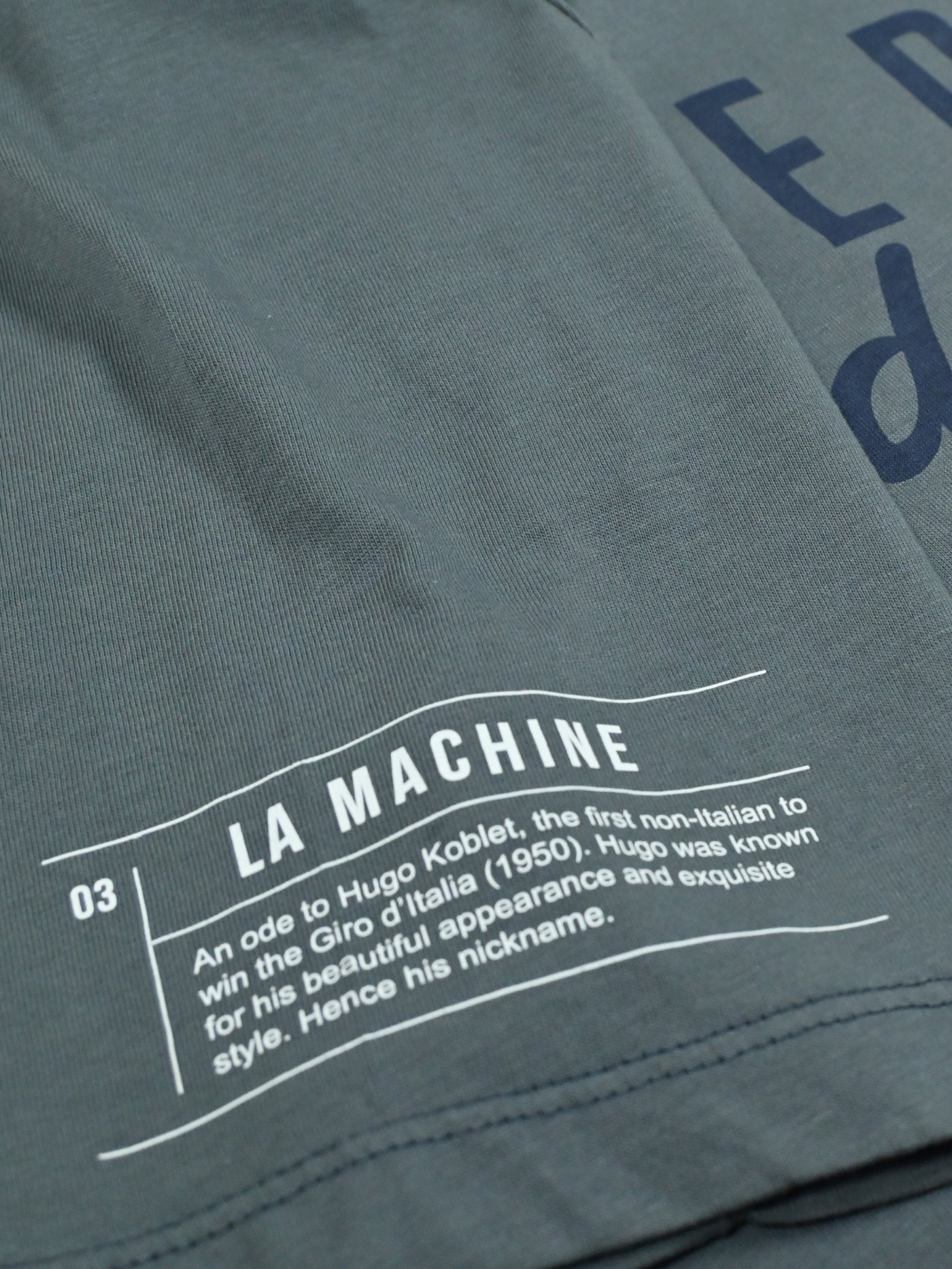The Pedaleur de Charme - T-shirt - Charcoal Teal by La Machine Cycle Club, shown from another angle.