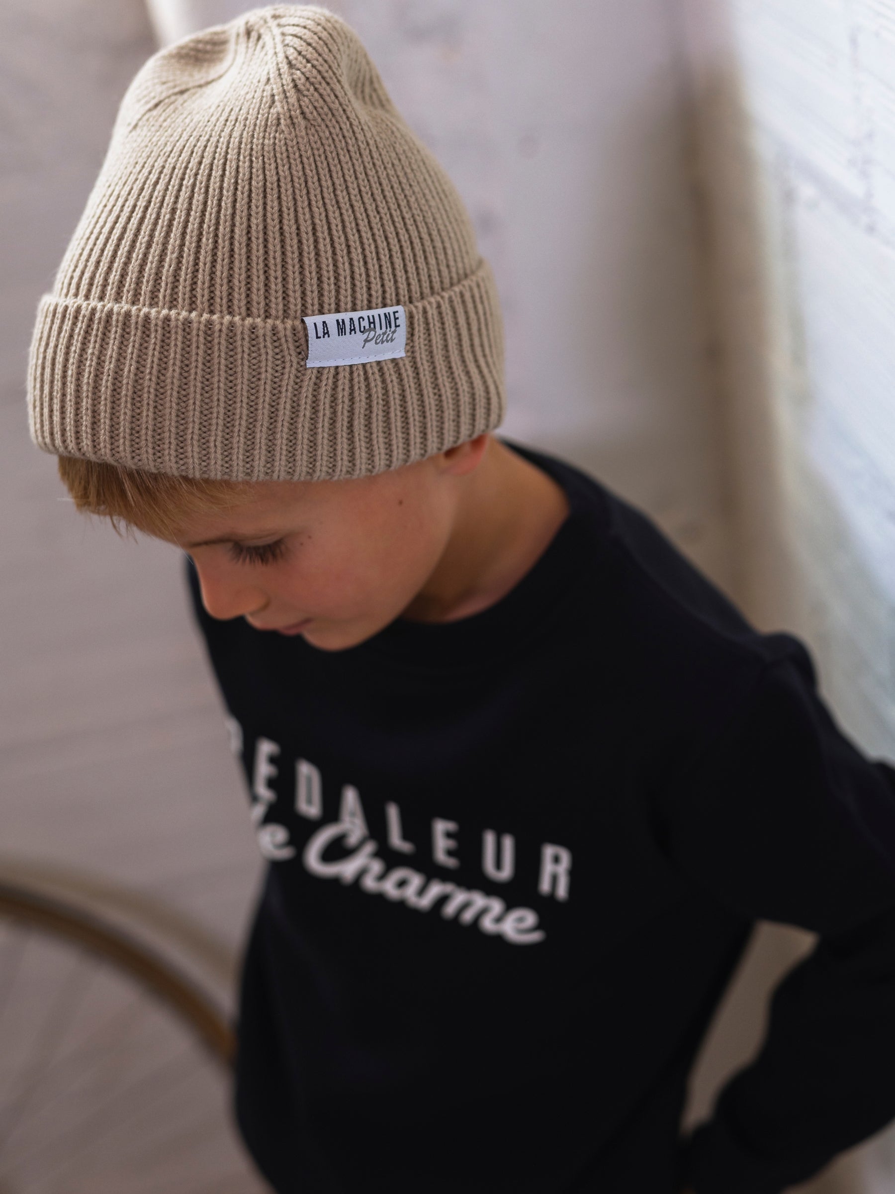The Petit - La Machine Beanie - Sand by La Machine Cycle Club, shown from another angle.