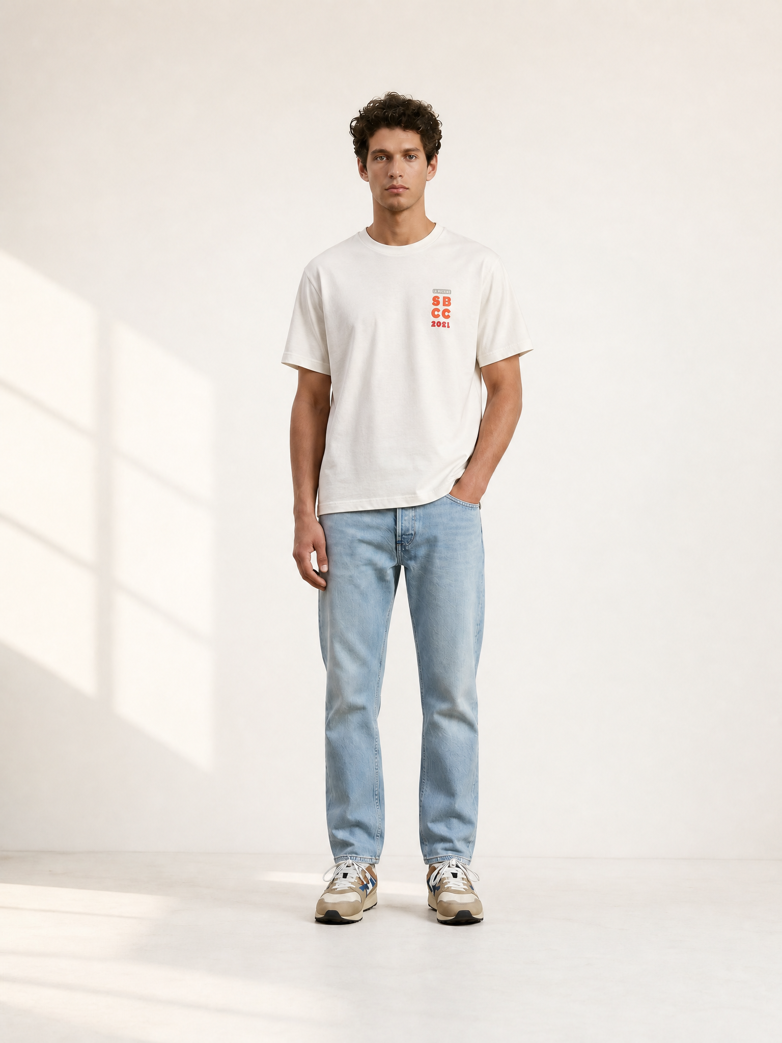 A model wearing the Sticky Bottles - Loose Fit - T-shirt by La Machine Cycle Club.