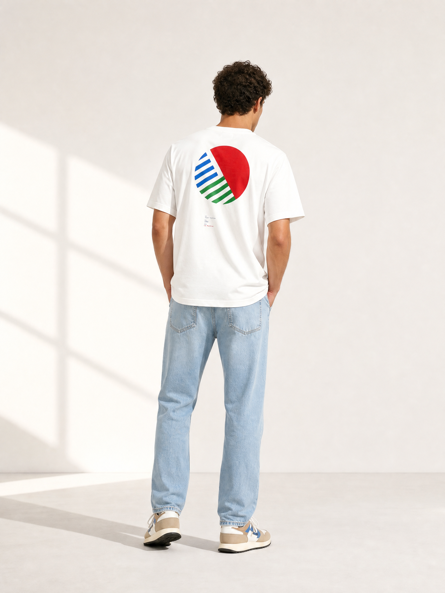 A model wearing the Team Toshiba '90 - Loose Fit - T-shirt by La Machine Cycle Club.