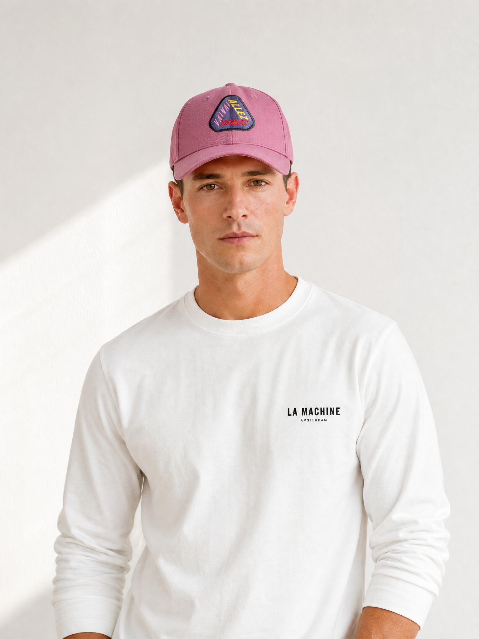 A model wearing the Vai, Allez, Vamos - Casual Cap by La Machine Cycle Club.