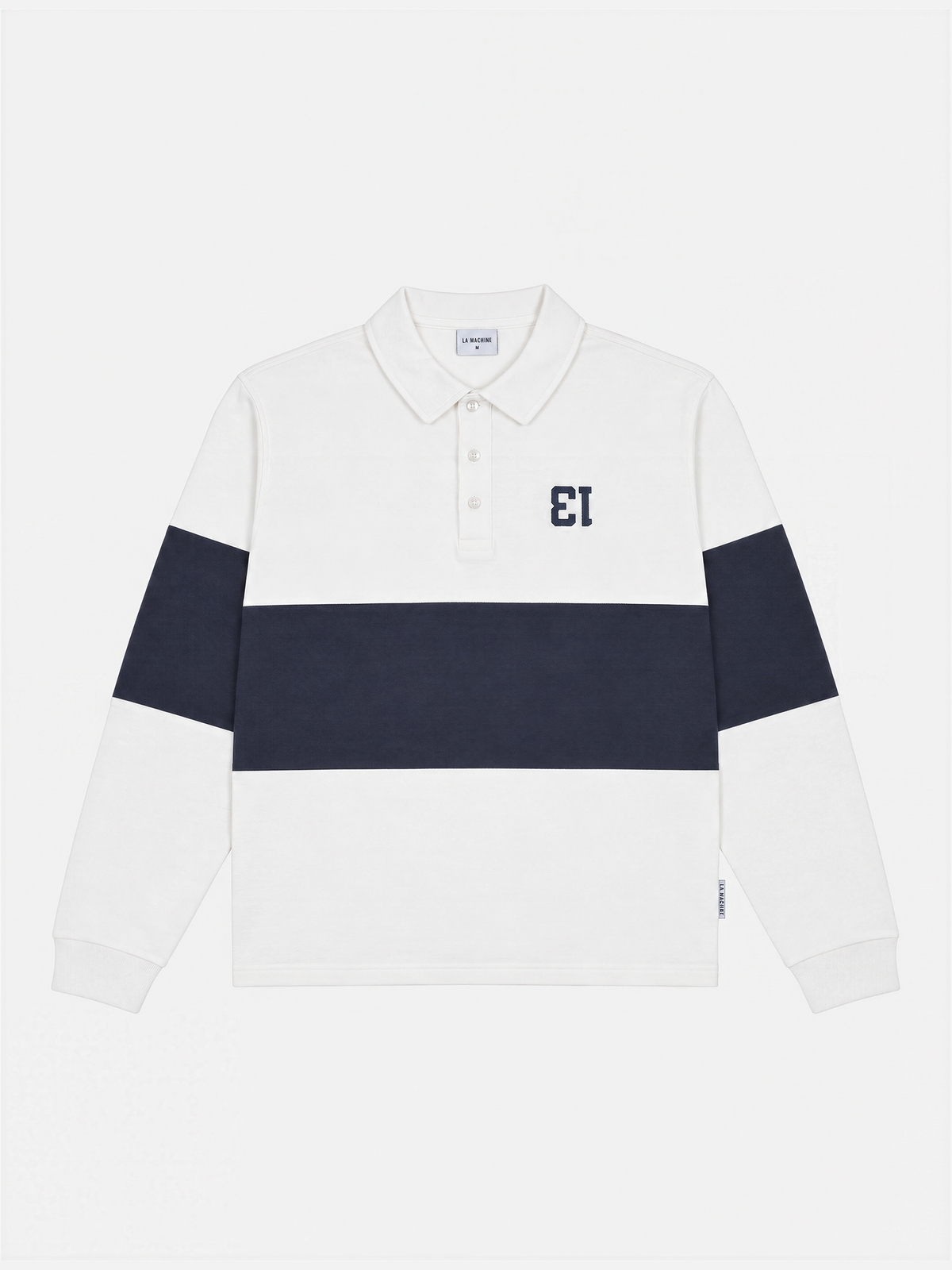 Front view of the Number 13 Longsleeve Polo in dark navy blue and off white, laid flat.