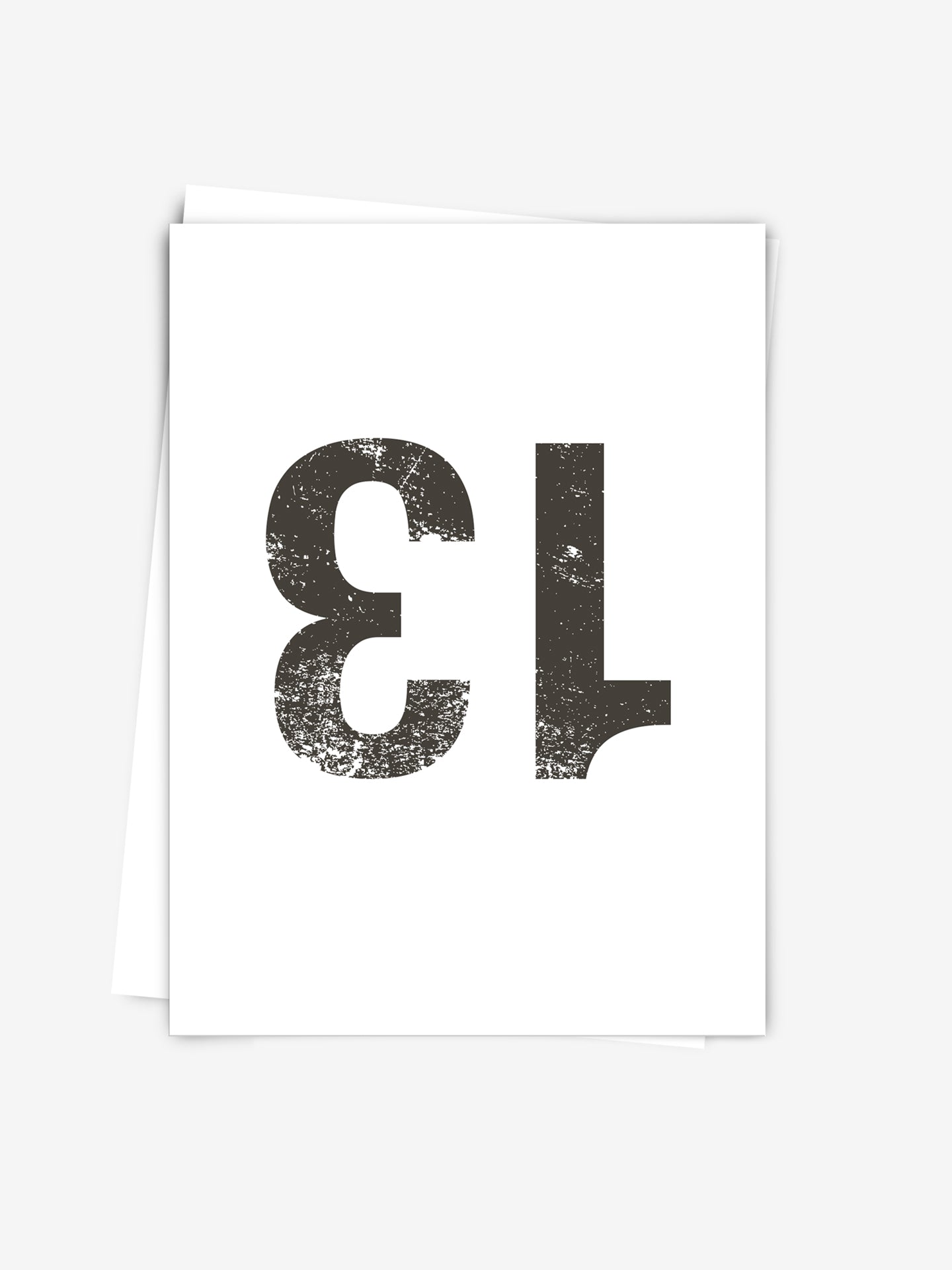 The Bib Number 13 - Postcard by La Machine Cycle Club features a bold, distressed black 13 printed upside down on a white card—perfect as a fun gift or collectible for cycling enthusiasts.