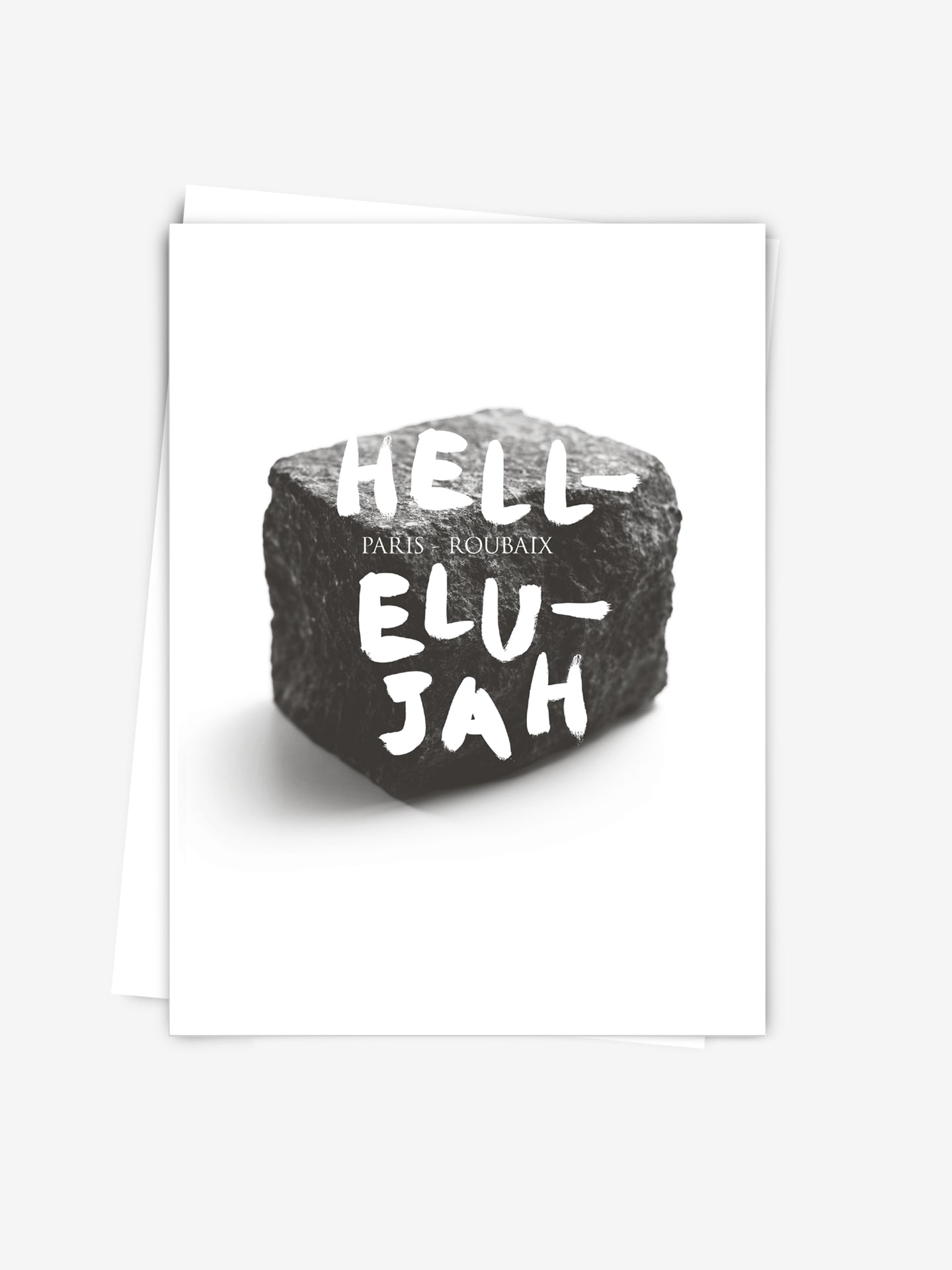 The Hellelujah - Postcard by La Machine Cycle Club features a black rock with “HELL ELU JAH” and “PARIS ROUBAIX” text, making it a unique Paris-Roubaix collectible for cycling fans. Printed on FSC-certified paper.