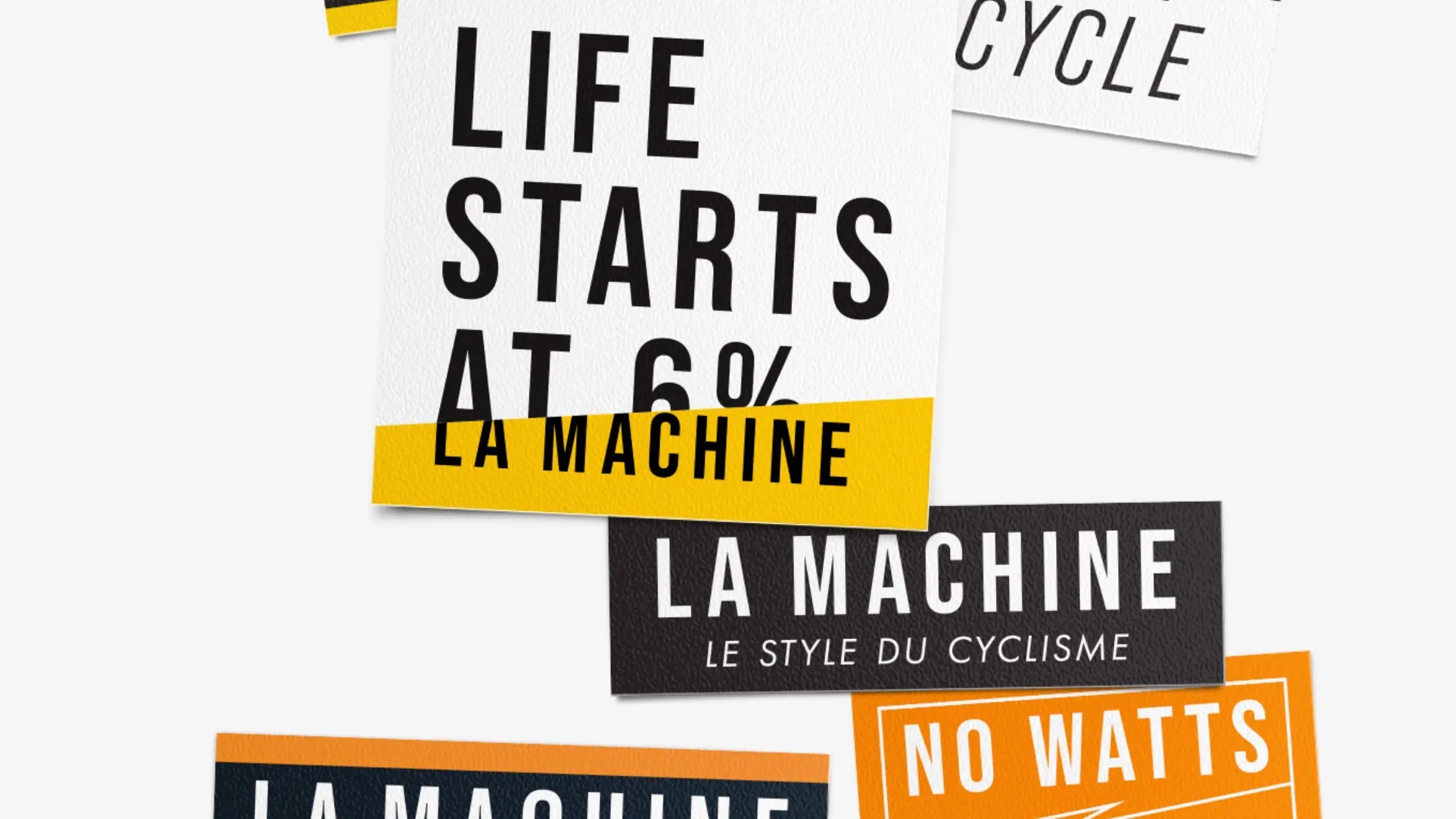 Several rectangular cards with bold text are layered; main card reads LIFE STARTS AT 6% LA MACHINE. Others read CYCLE, LA MACHINE LE STYLE DU CYCLISME, and NO WATTS.