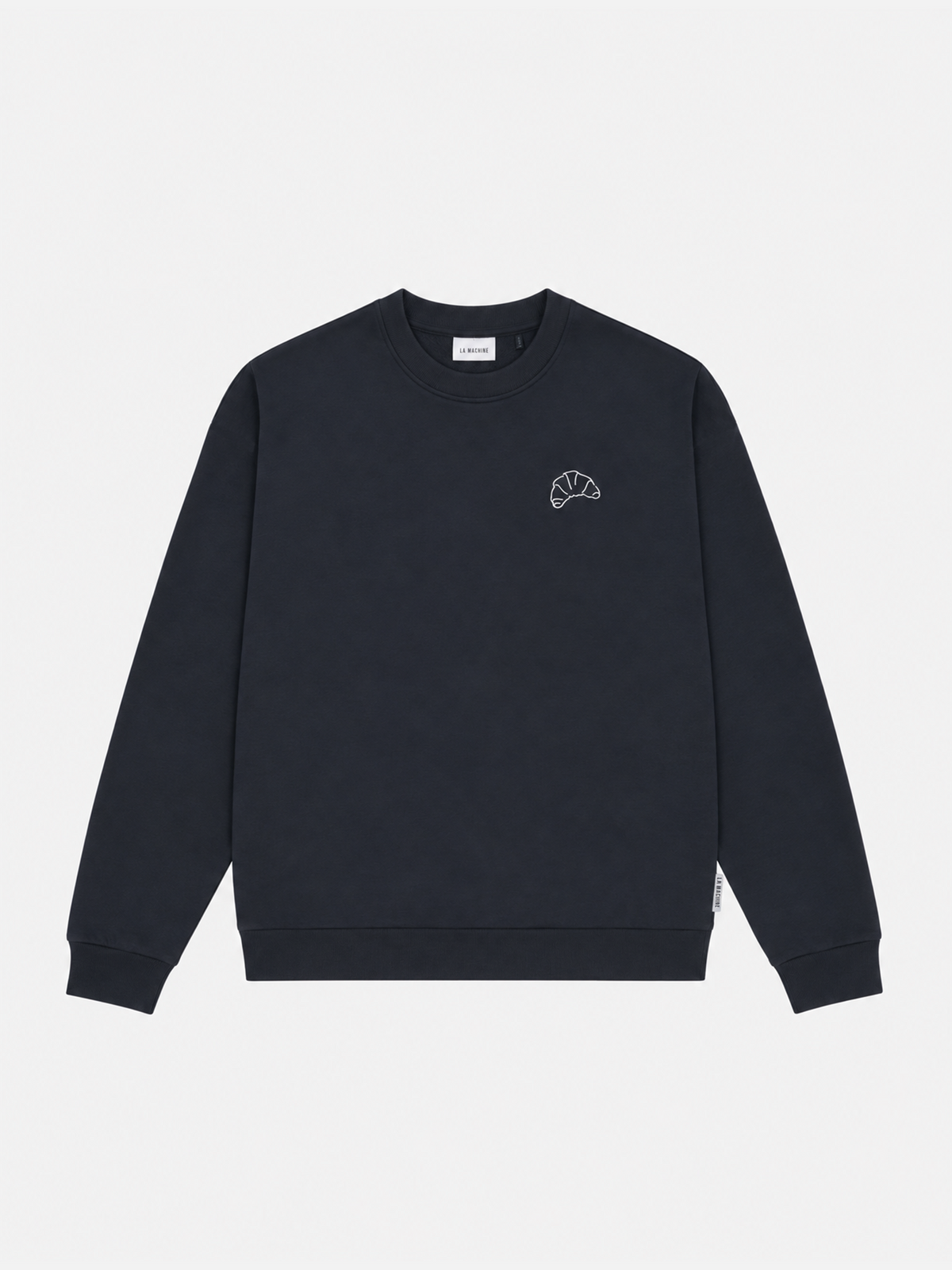 Detail of the print on the I Brake for Croissants sweatshirt in dark navy blue.