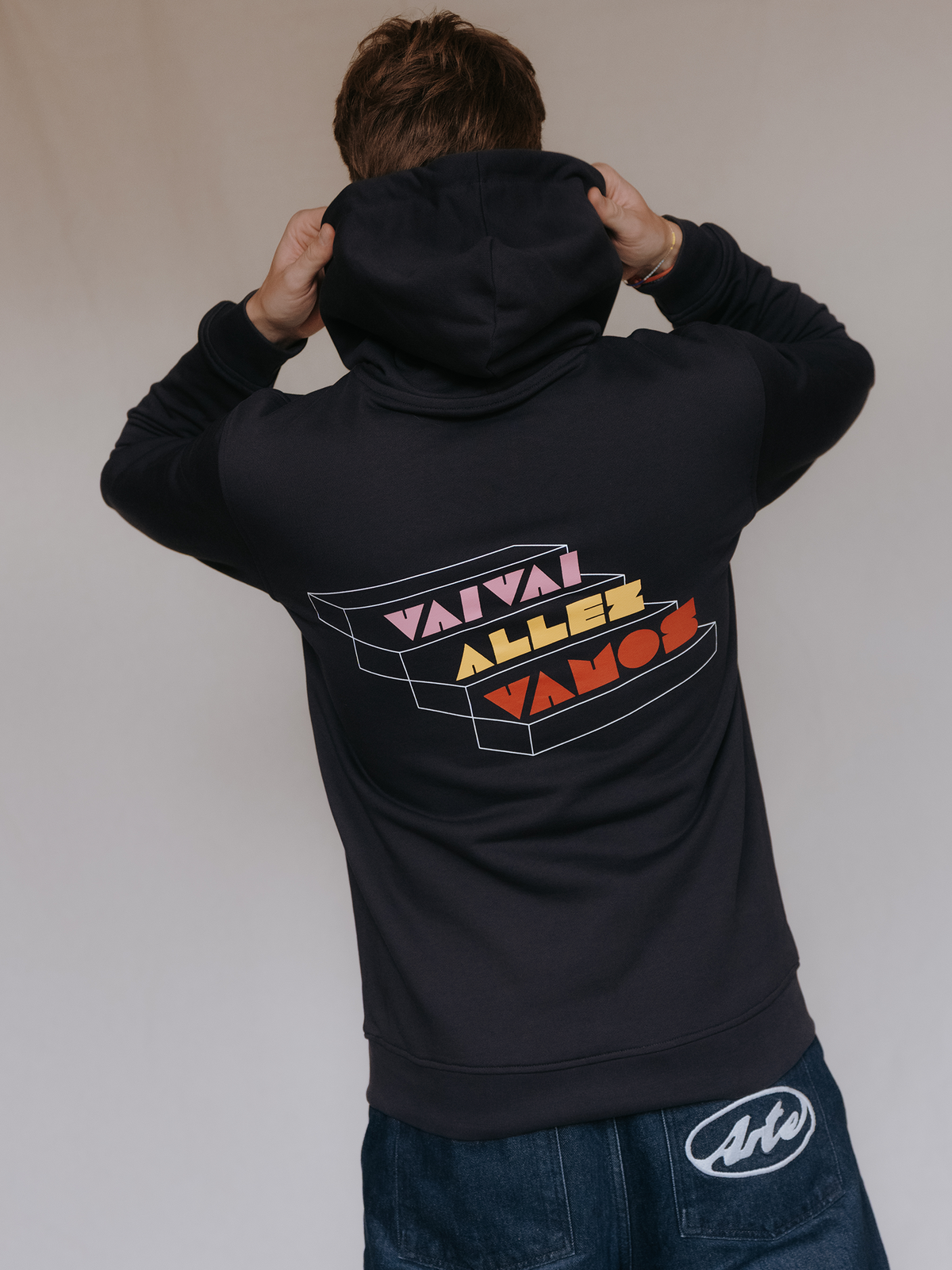 Grand Tours Hoodie in dark navy blue by La Machine, worn by a model.