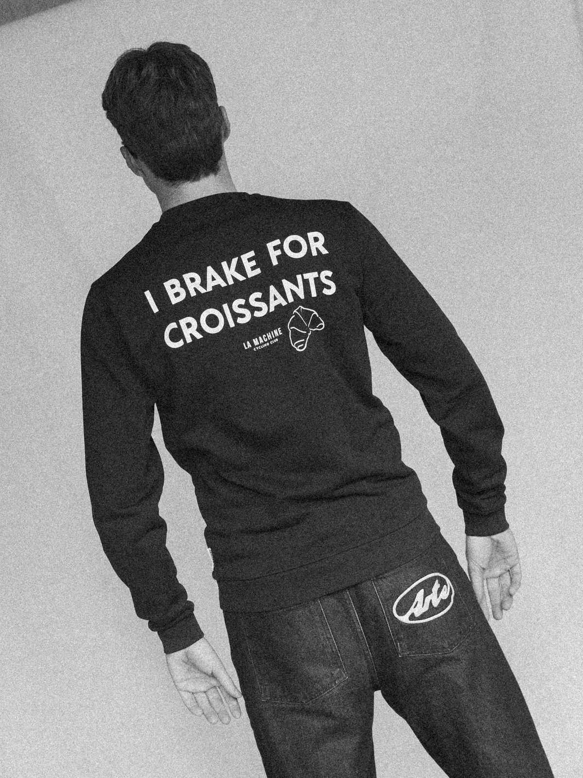 Close-up of the ribbed cuff on the I Brake for Croissants Sweatshirt.
