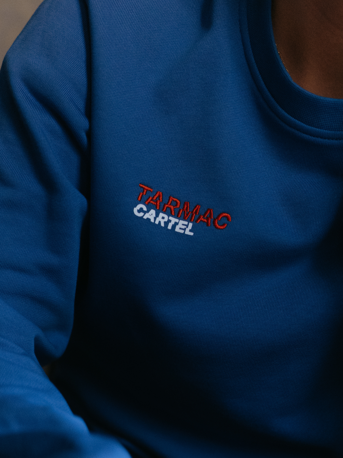 The Tarmac Cartel Sweatshirt in marine blue by La Machine, folded.
