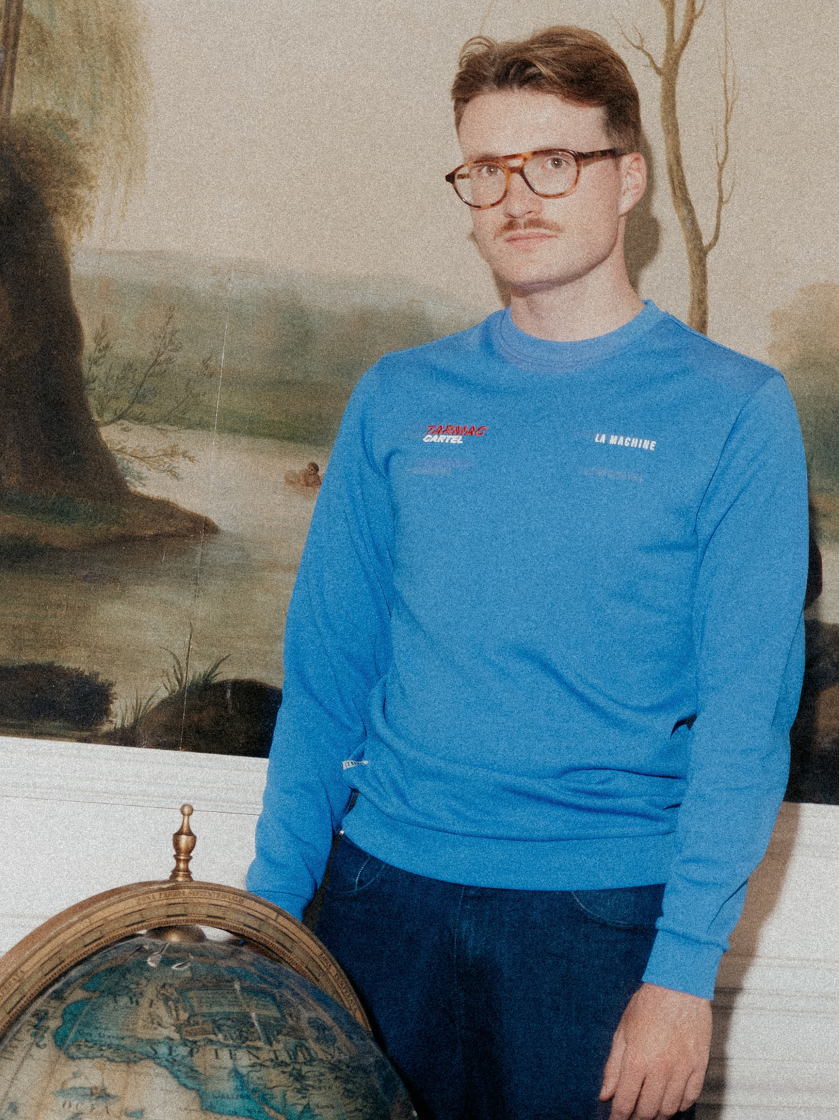 Side view of the Tarmac Cartel Sweatshirt in marine blue.