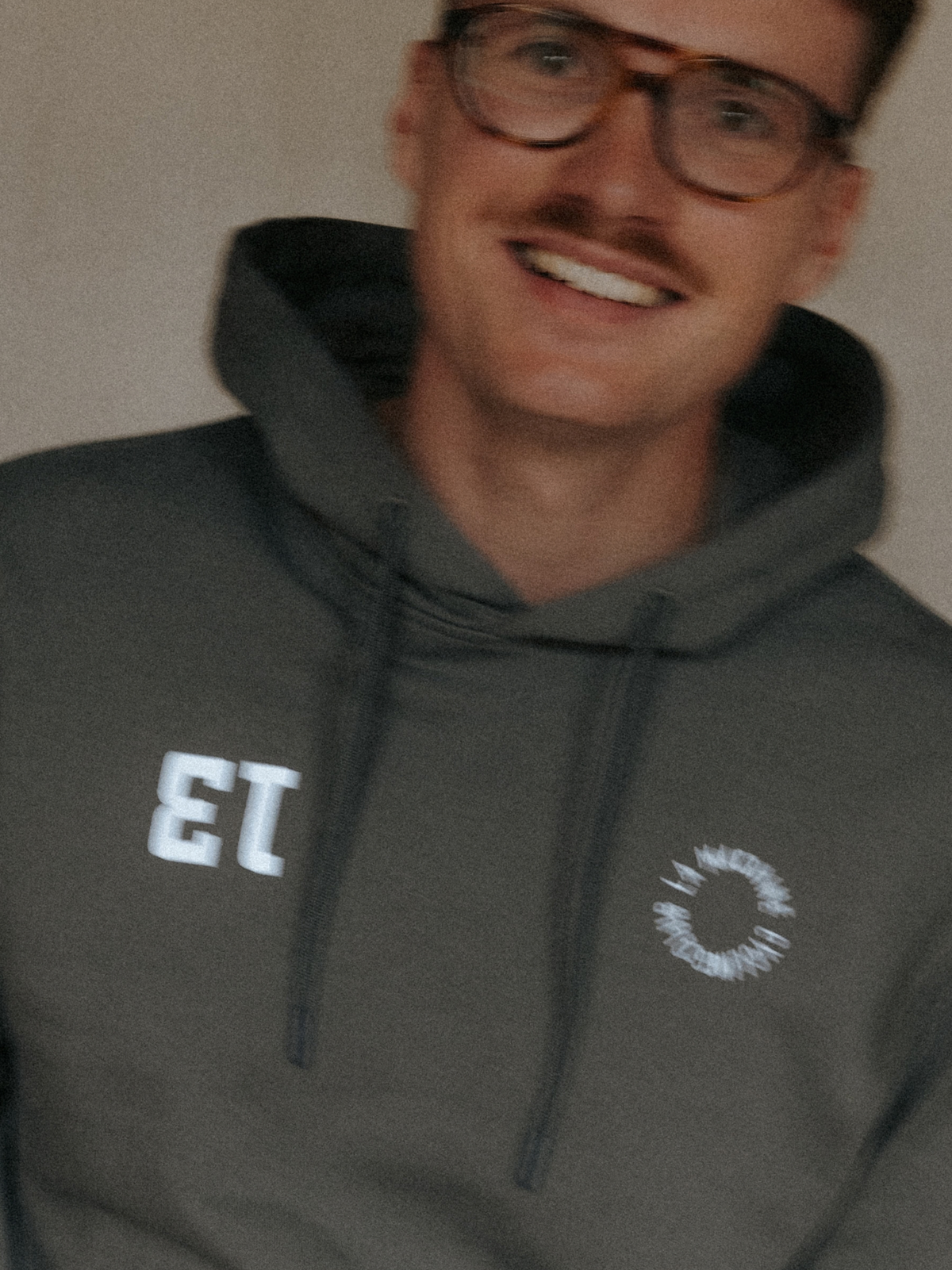 Side view of the Vamos Hoodie in asphalt grey.