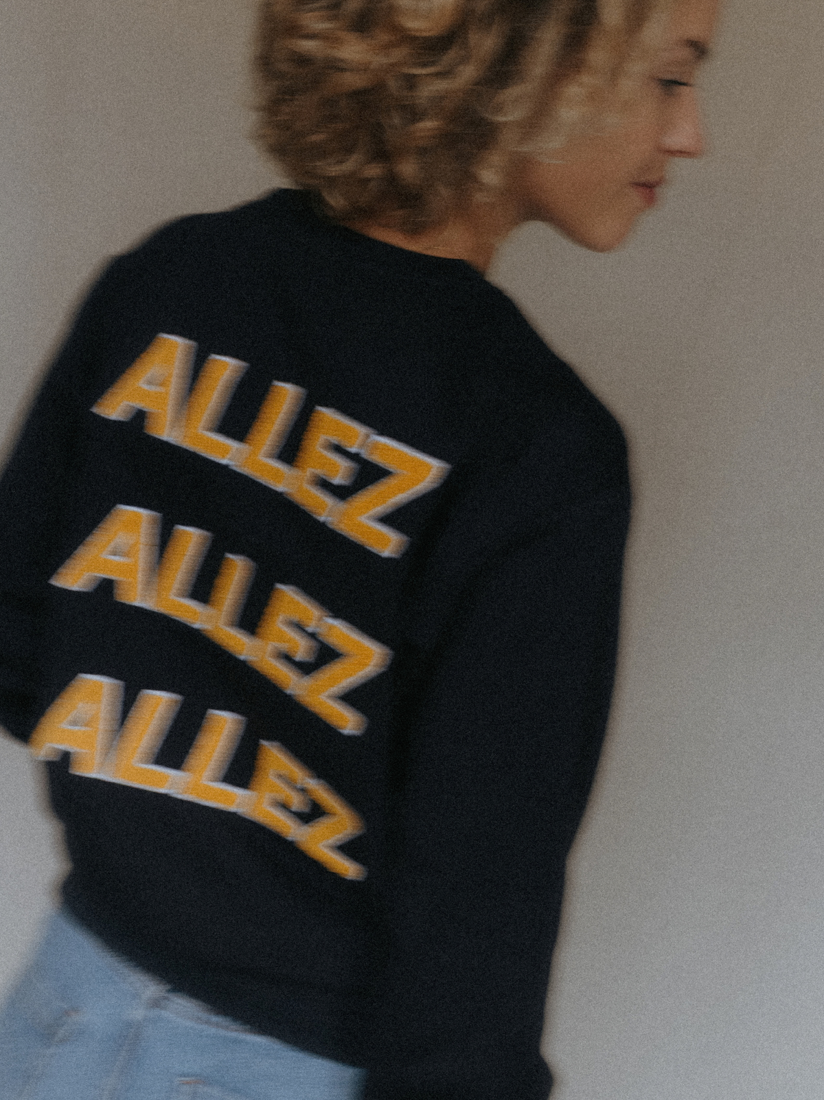 The Allez Allez Allez Sweatshirt in dark navy blue by La Machine, folded.