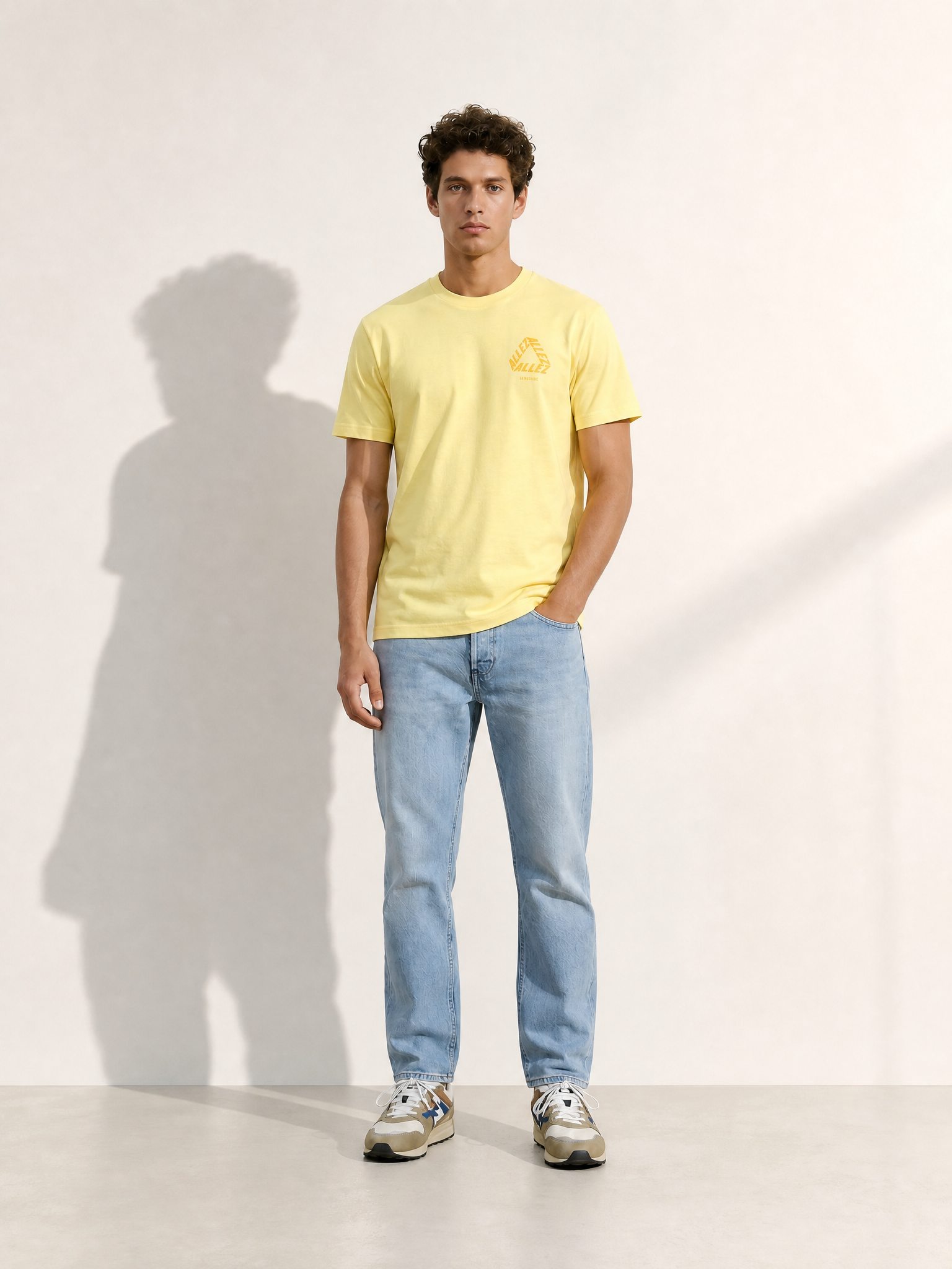 A model wearing the Allez - Loose Fit - Tour de France T-shirt by La Machine Cycle Club.