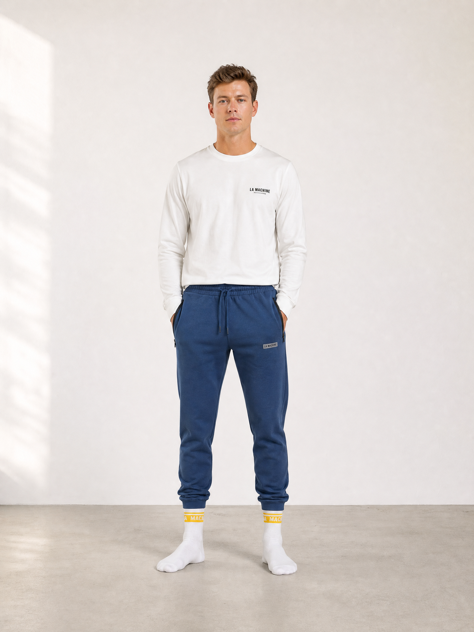 A model wearing the Beyond the bike - Sweatpants - Sarragosa Sea by La Machine Cycle Club.