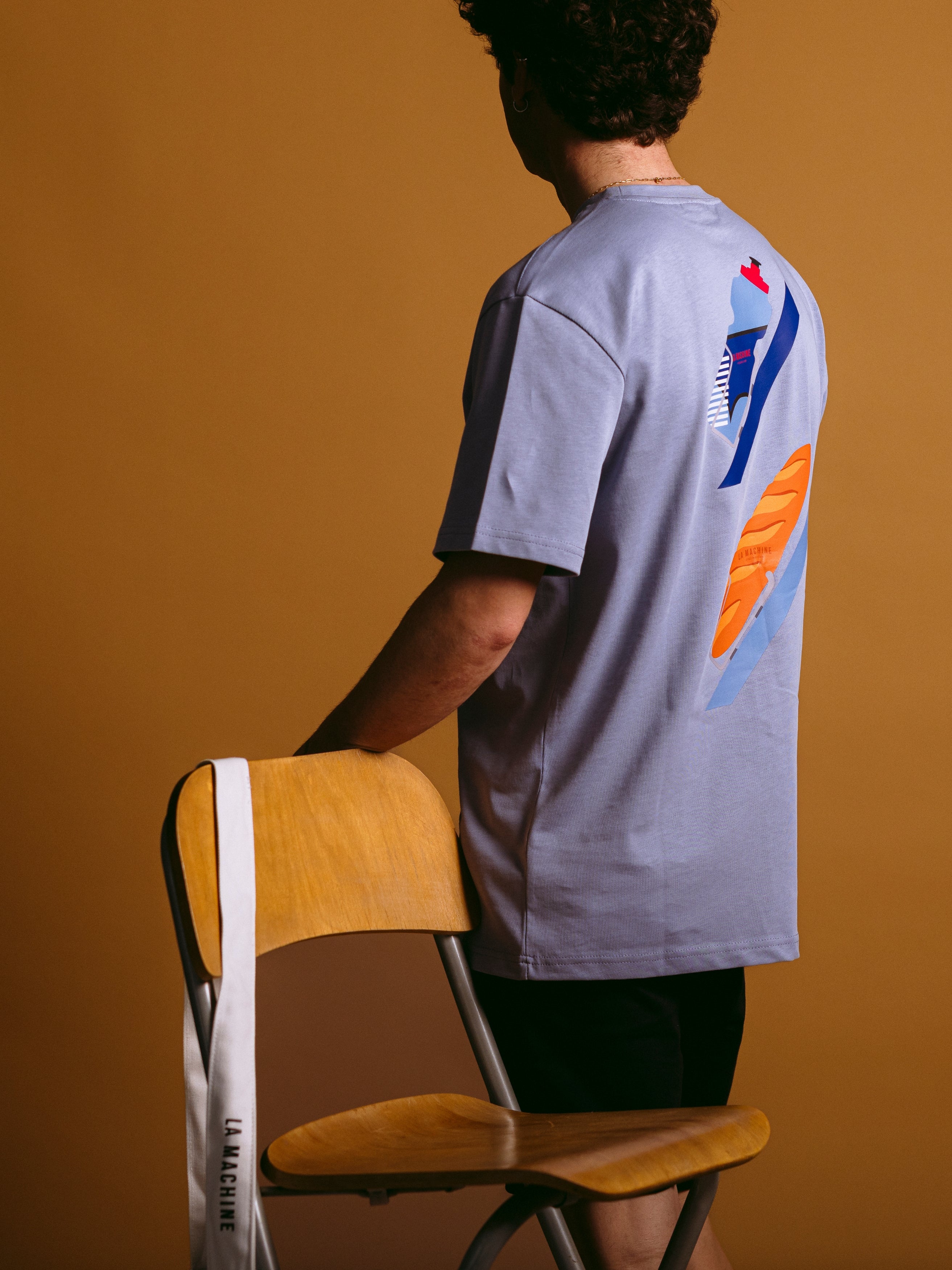 The Bidon et Baguette - Loose Fit - T-shirt by La Machine Cycle Club, shown from another angle.