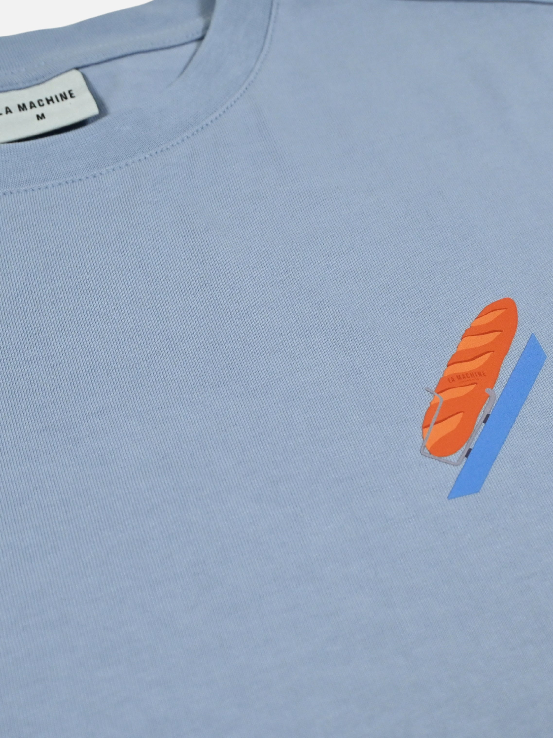 Detail view of the Bidon et Baguette - Loose Fit - T-shirt by La Machine Cycle Club.