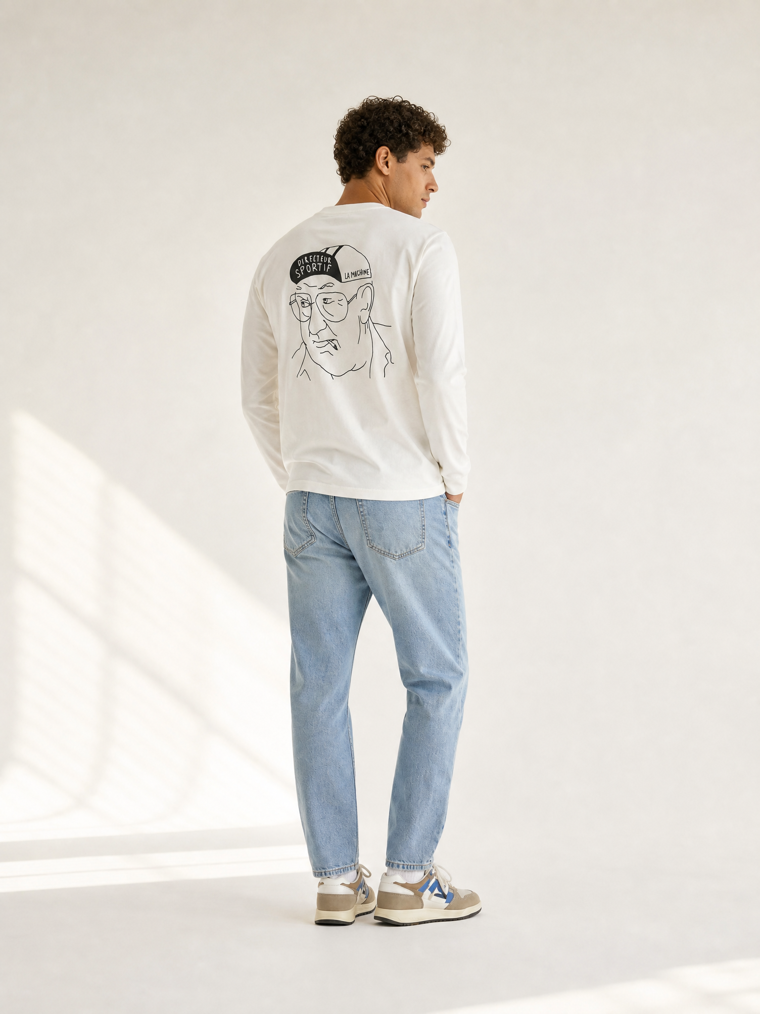 A model wearing the Directeur Sportif - Longsleeve by La Machine Cycle Club.