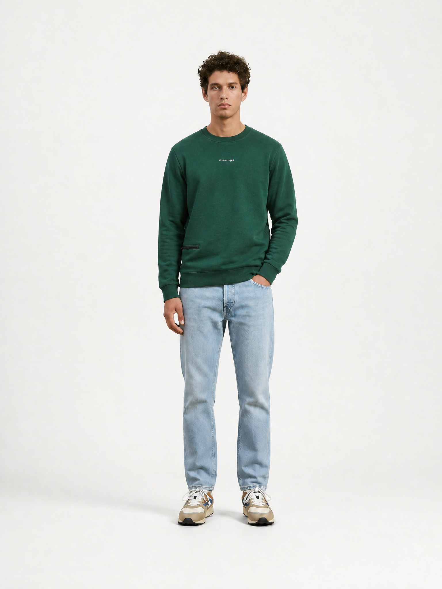 A model wearing the Domestique - Sweatshirt by La Machine Cycle Club.