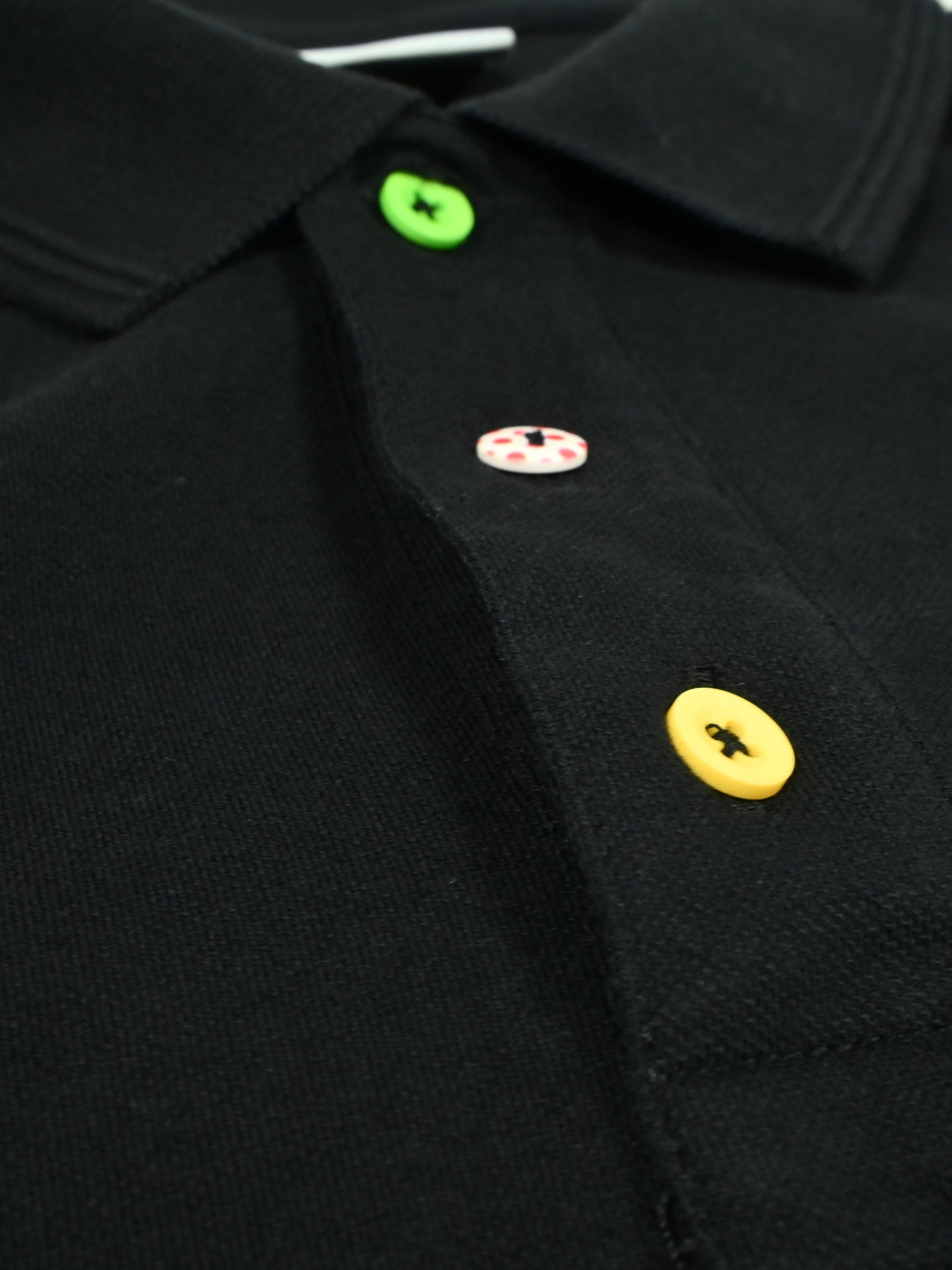 Detail view of the Grande Boucle - Polo Shirt - Black by La Machine Cycle Club.
