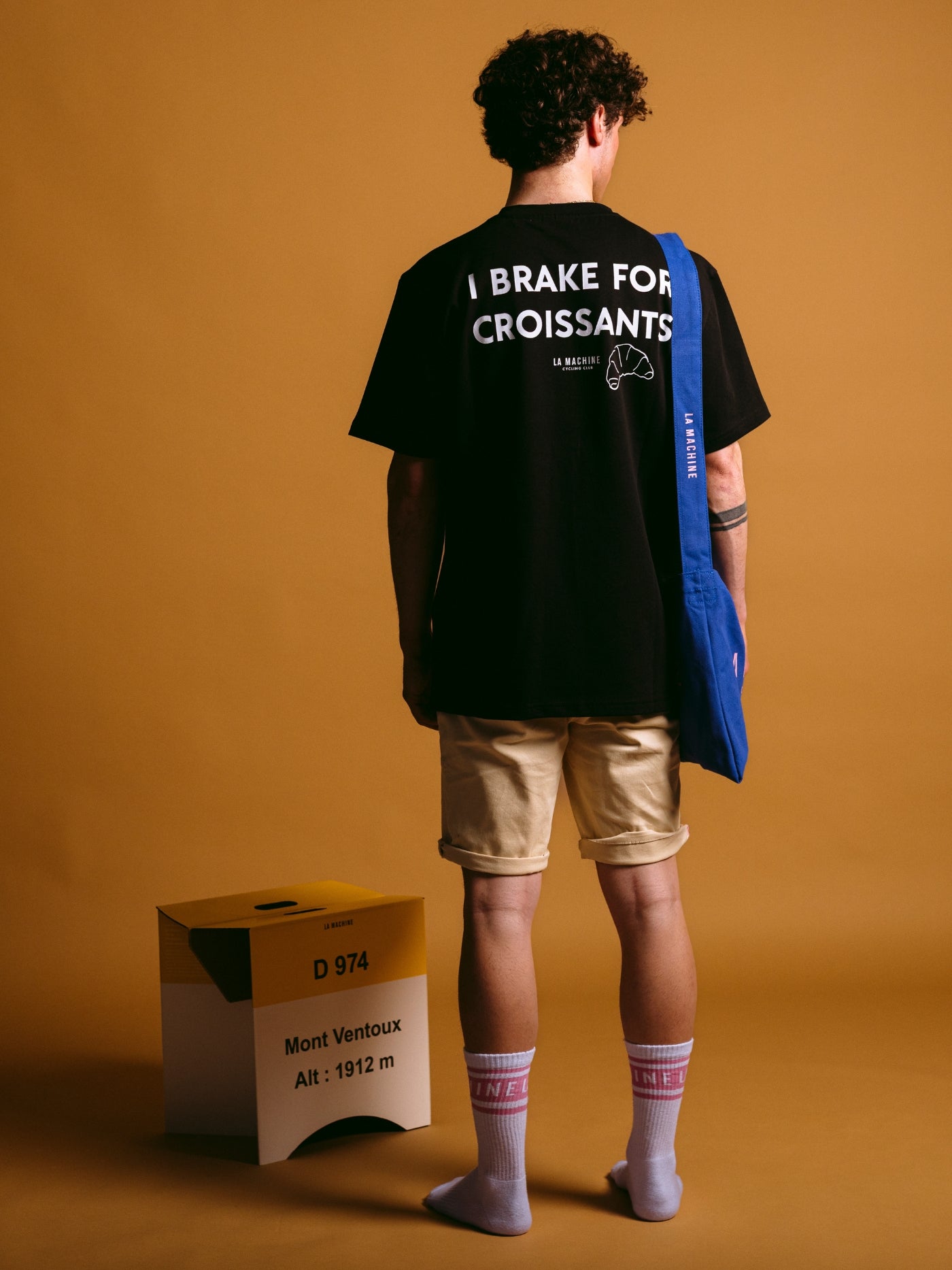The I Brake for Croissants - Loose Fit - T-shirt - Black by La Machine Cycle Club, shown from another angle.