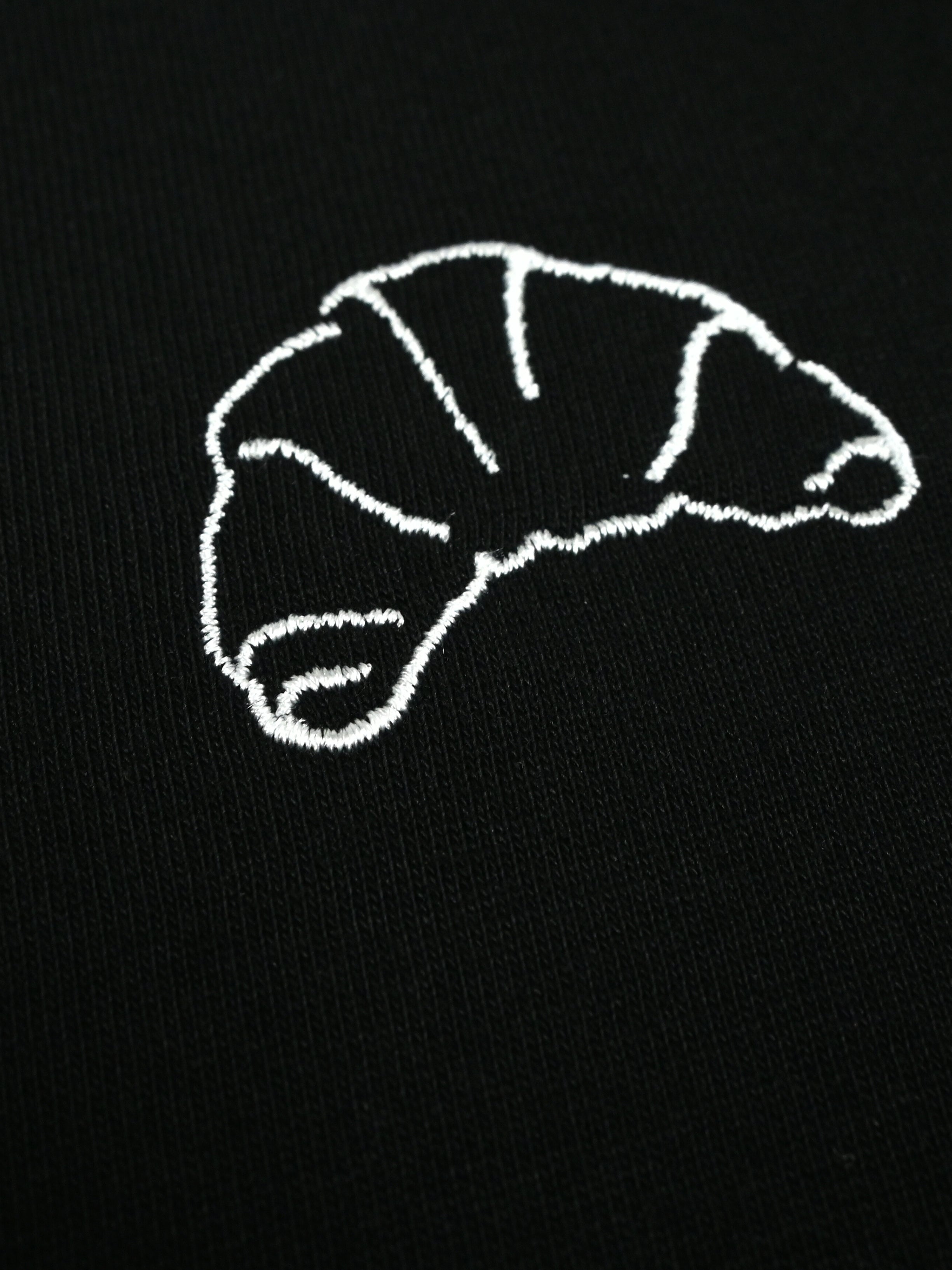 The I Brake for Croissants - Loose Fit - T-shirt - Black by La Machine Cycle Club, shown from another angle.