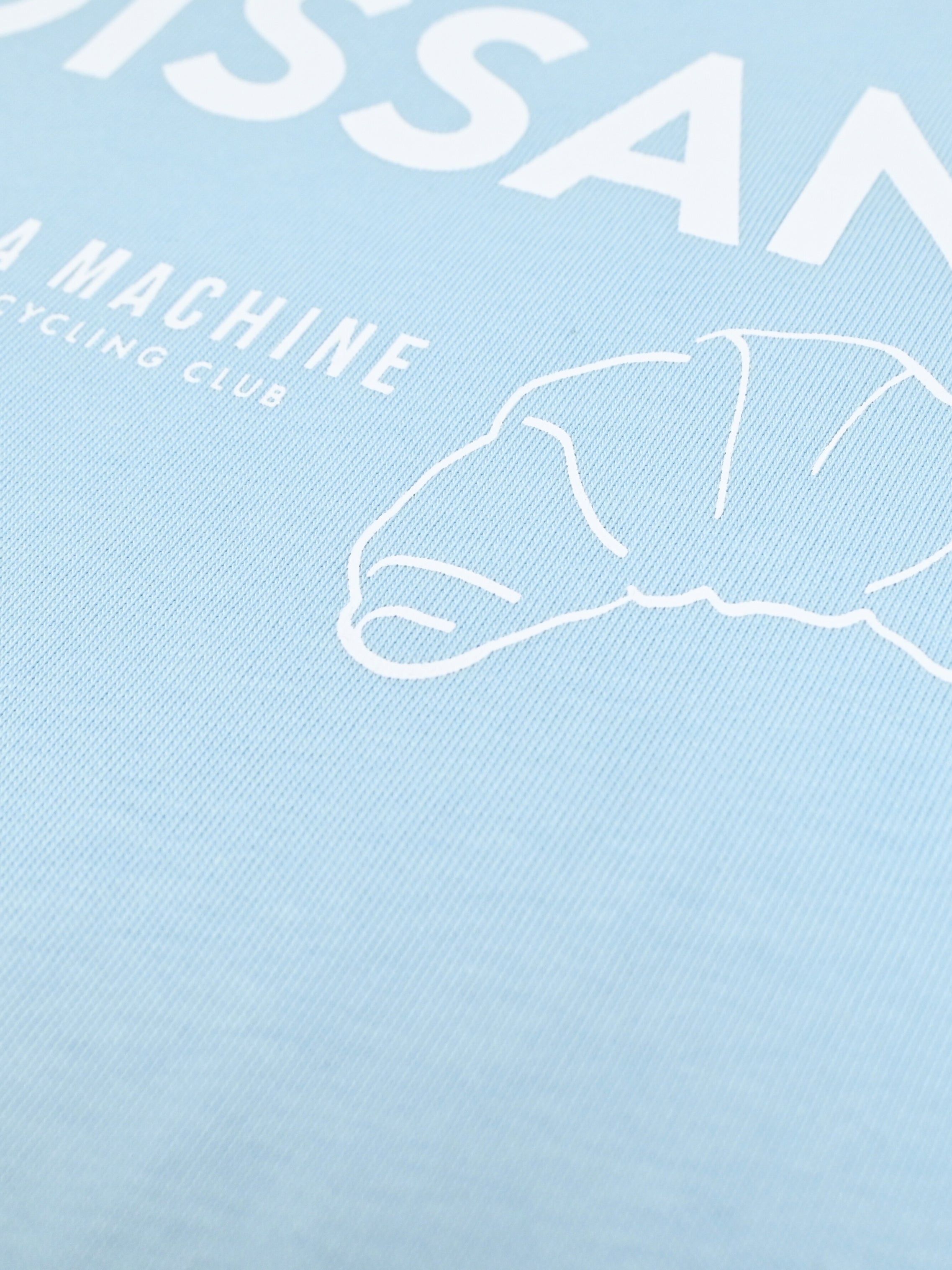 The I Brake for Croissants - Loose Fit - T-shirt - Light Blue by La Machine Cycle Club, shown from another angle.