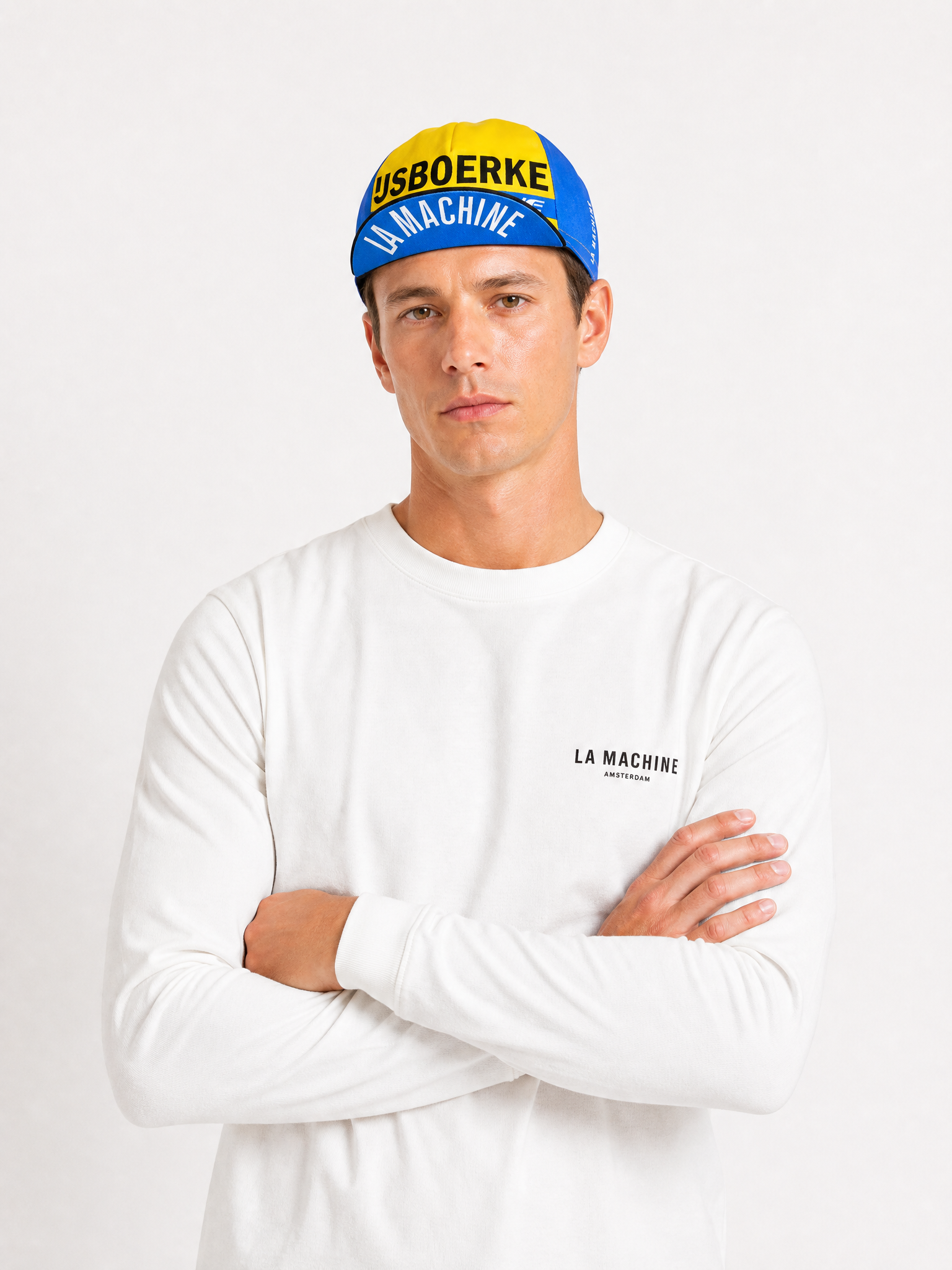 A model wearing the IJsboerke - Cycling Cap by La Machine Cycle Club.