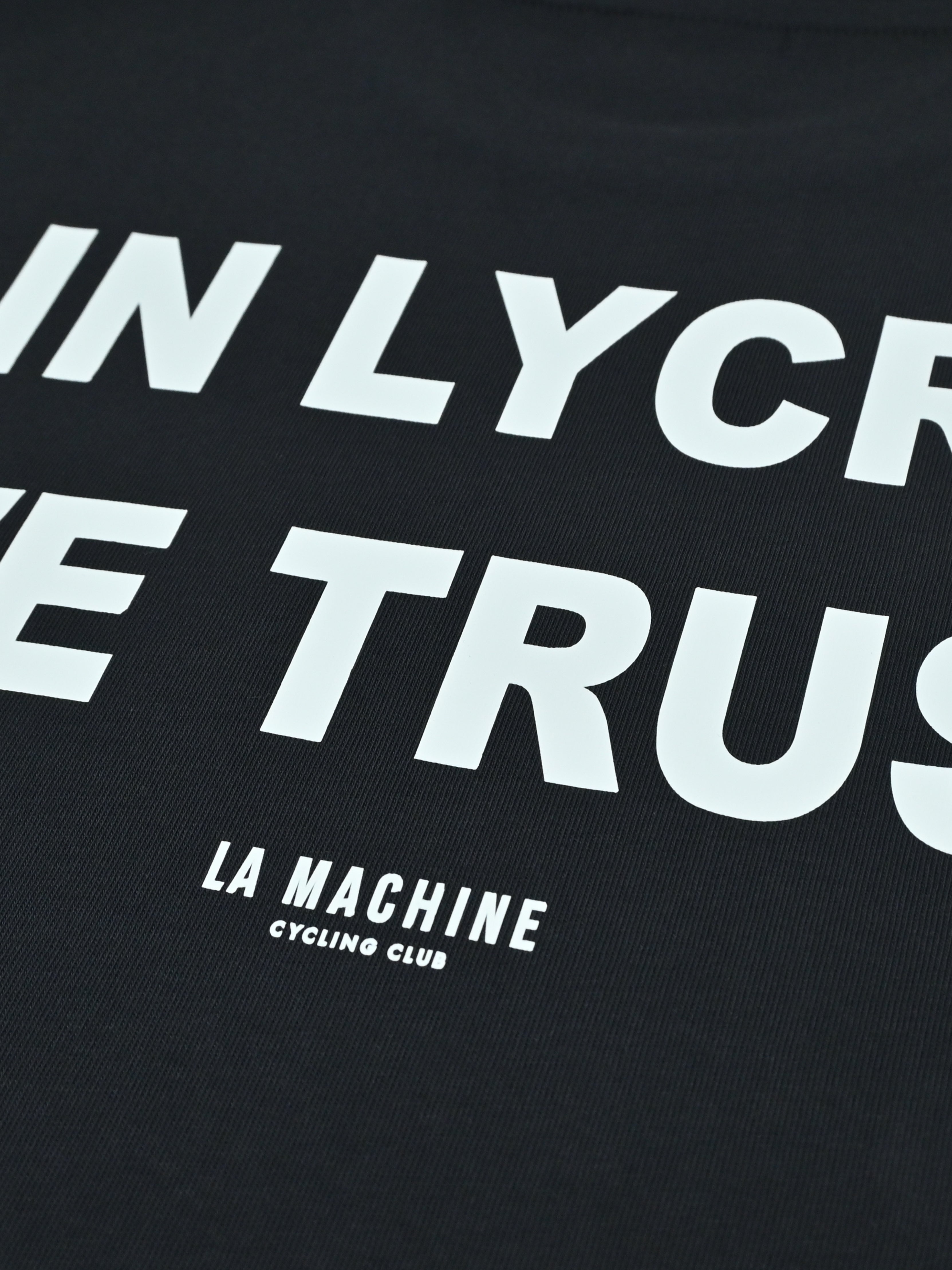 Detail view of the In Lycra We Trust - T-shirt - Dark Navy Blue by La Machine Cycle Club.
