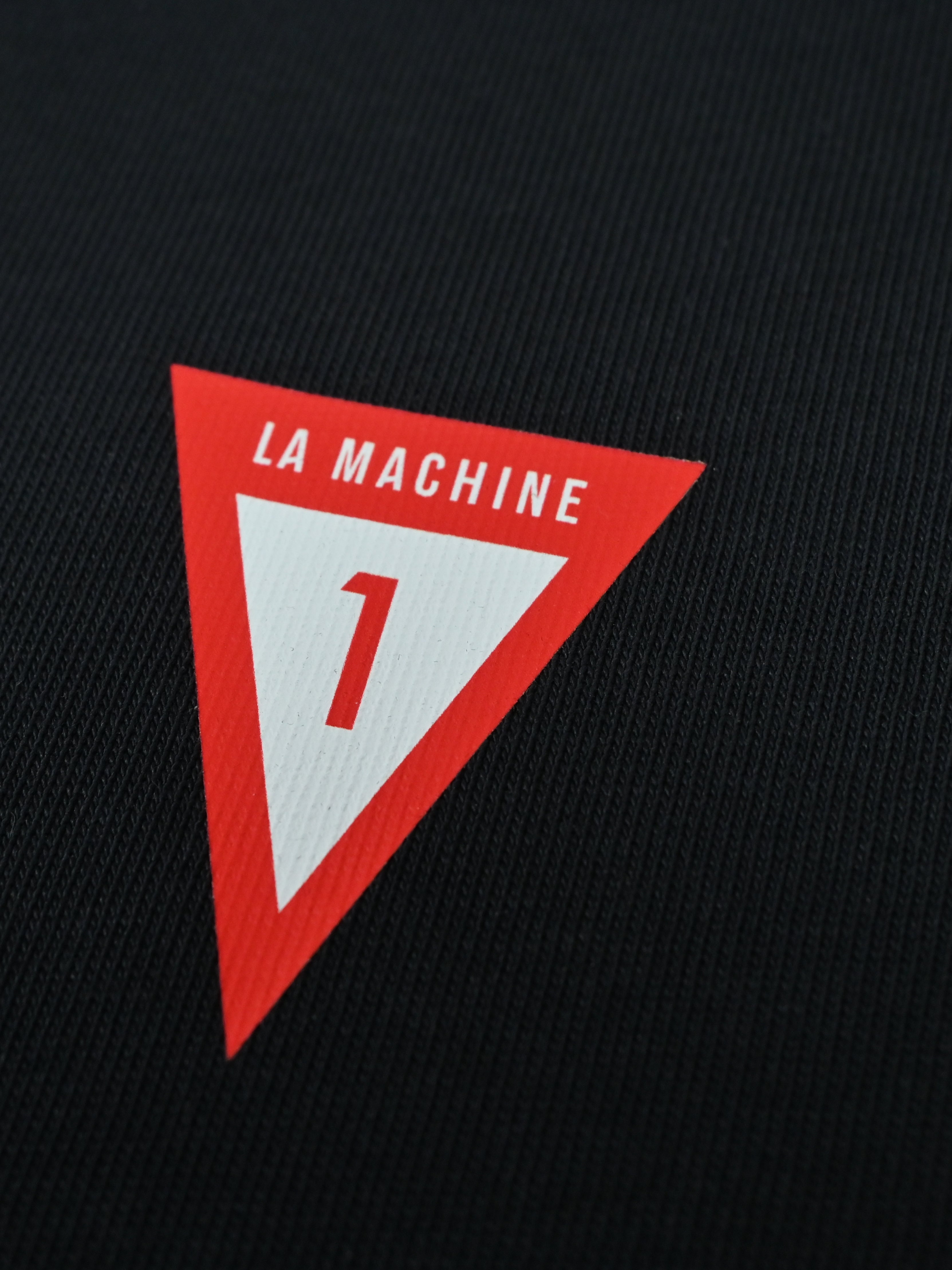 Detail view of the In Lycra We Trust - T-shirt - Dark Navy Blue by La Machine Cycle Club.