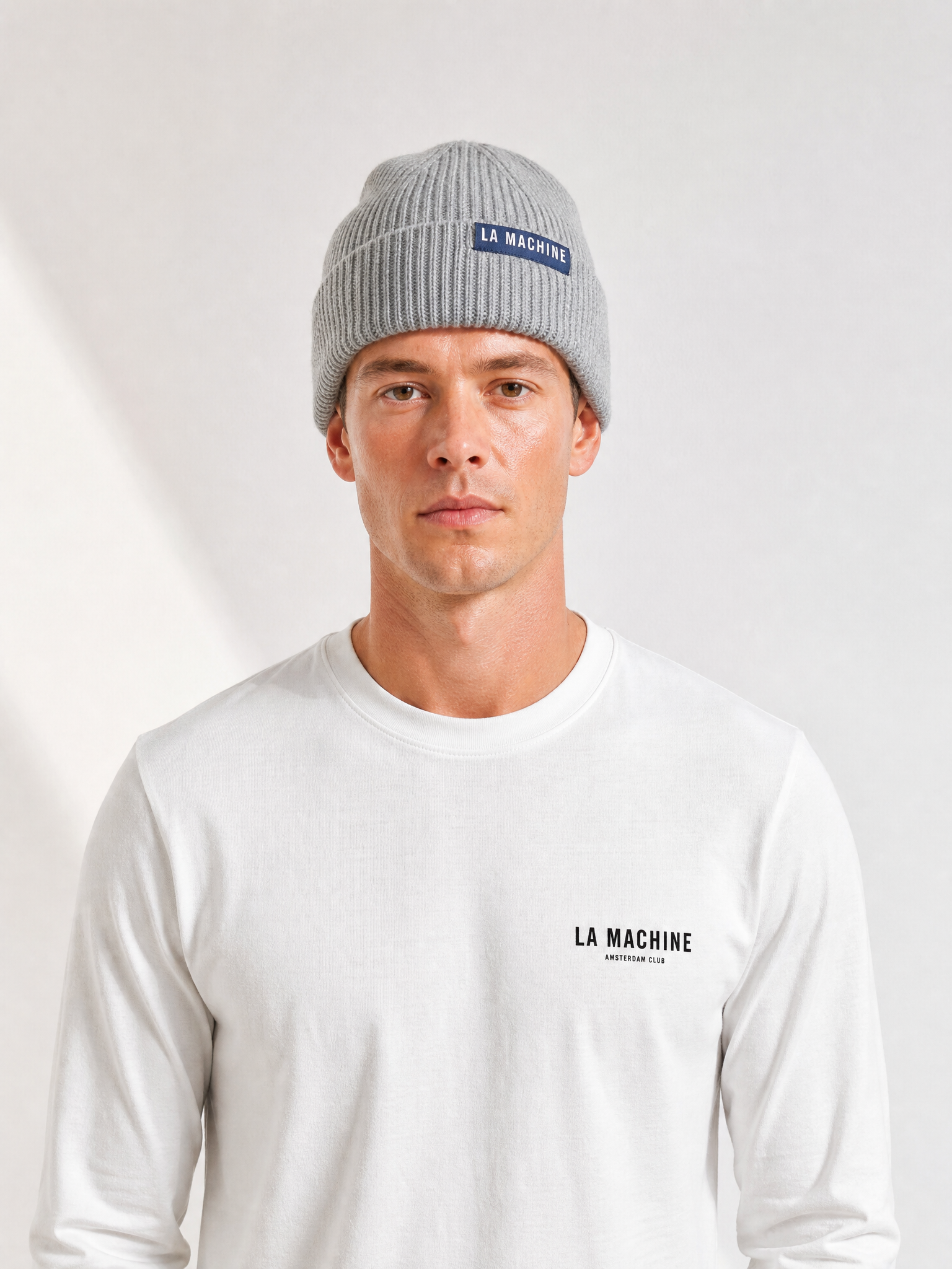 A model wearing the La Machine - Beanie - Grey Melange by La Machine Cycle Club.