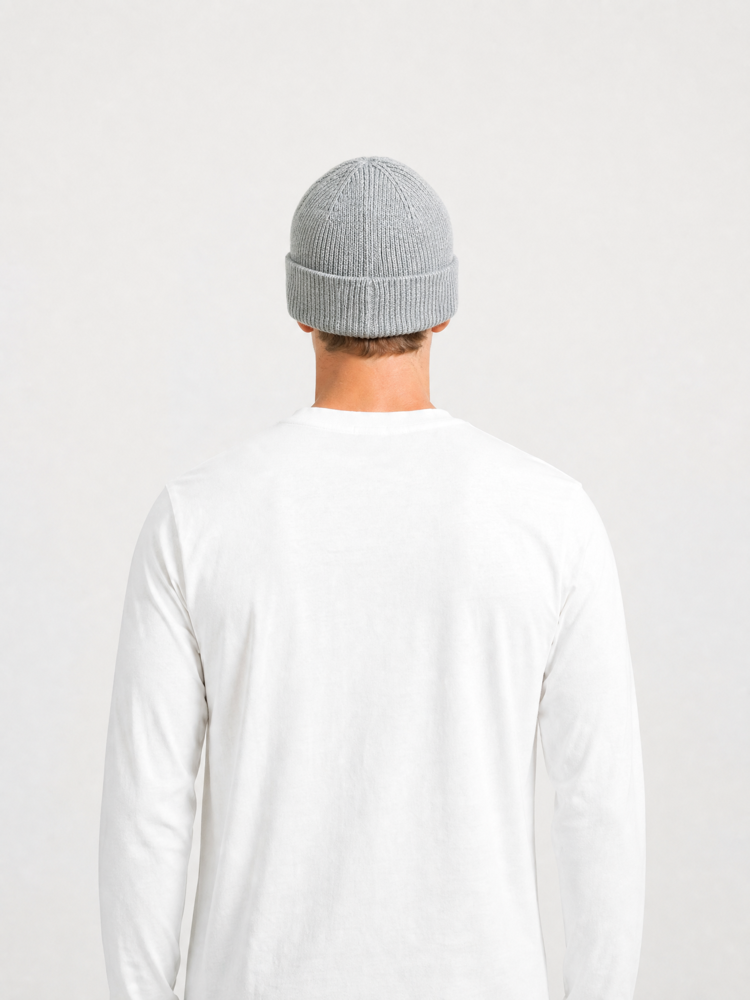 A model wearing the La Machine - Beanie - Grey Melange by La Machine Cycle Club.