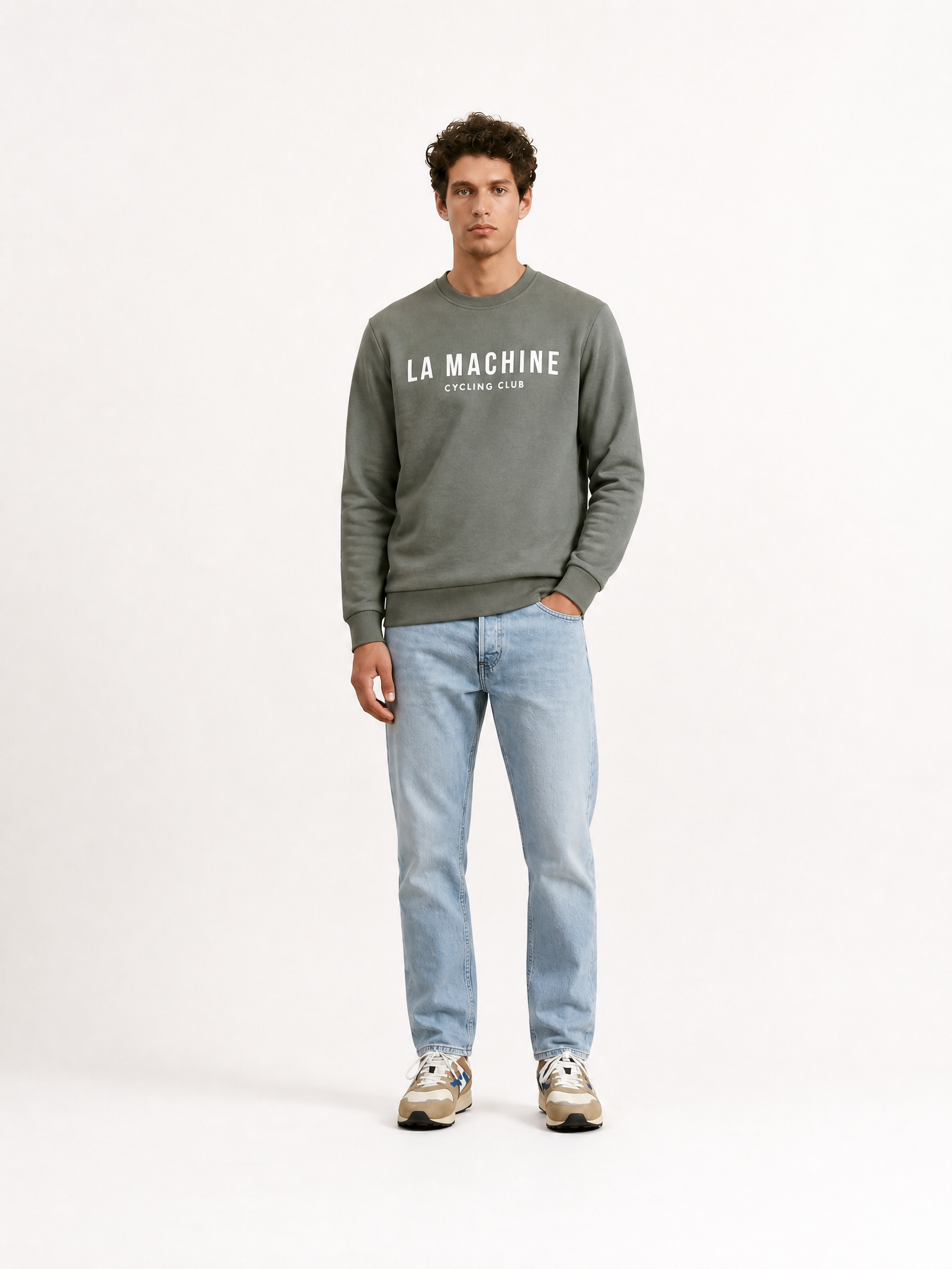 A model wearing the La Machine Club Line - Sweatshirt - Castor Grey by La Machine Cycle Club.