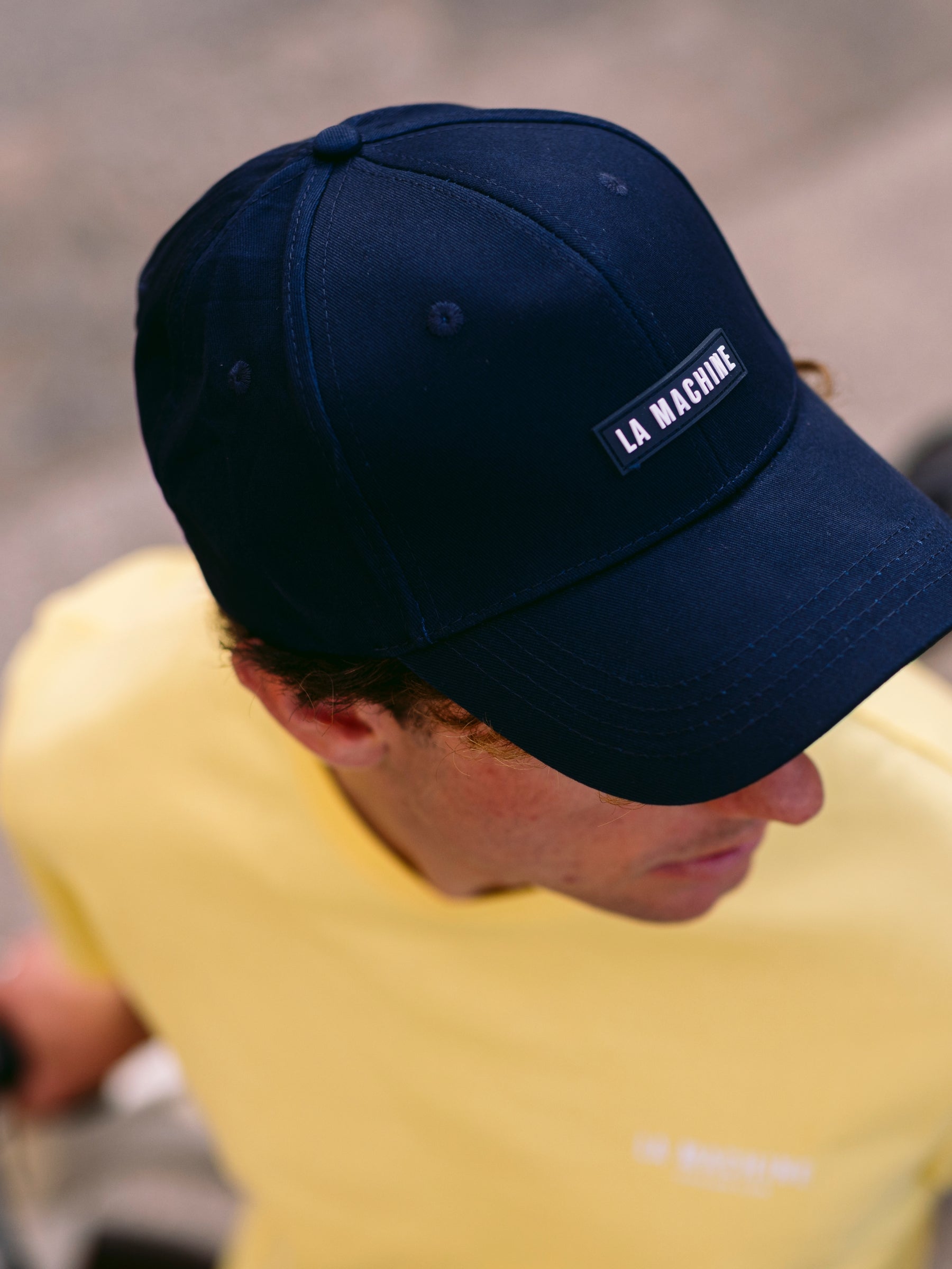 The La Machine Logo - Casual Cap by La Machine Cycle Club, shown from another angle.