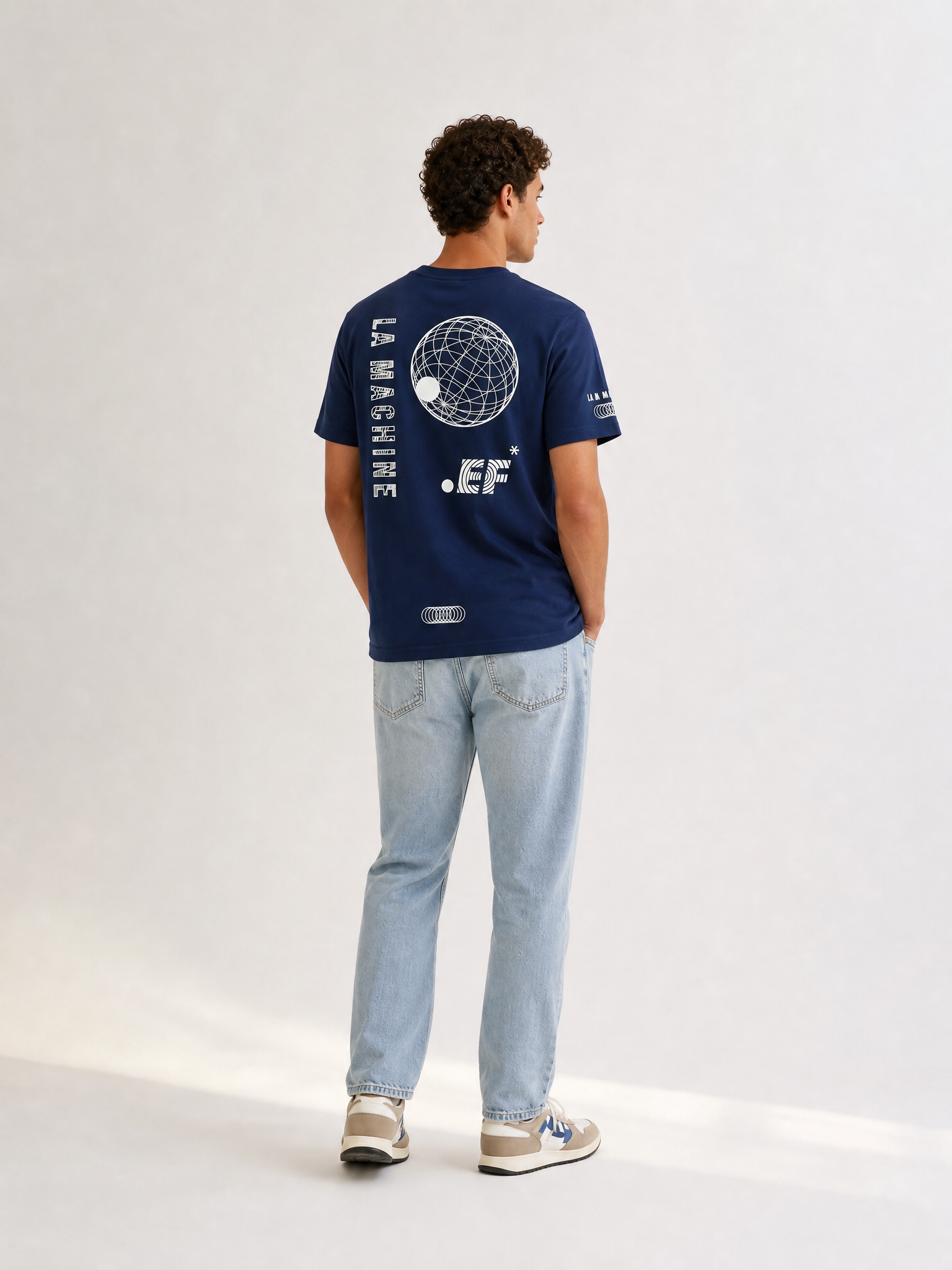 A model wearing the La Machine X EF Pro Cycling - Globe T-shirt - Dark Navy Blue by La Machine Cycle Club.