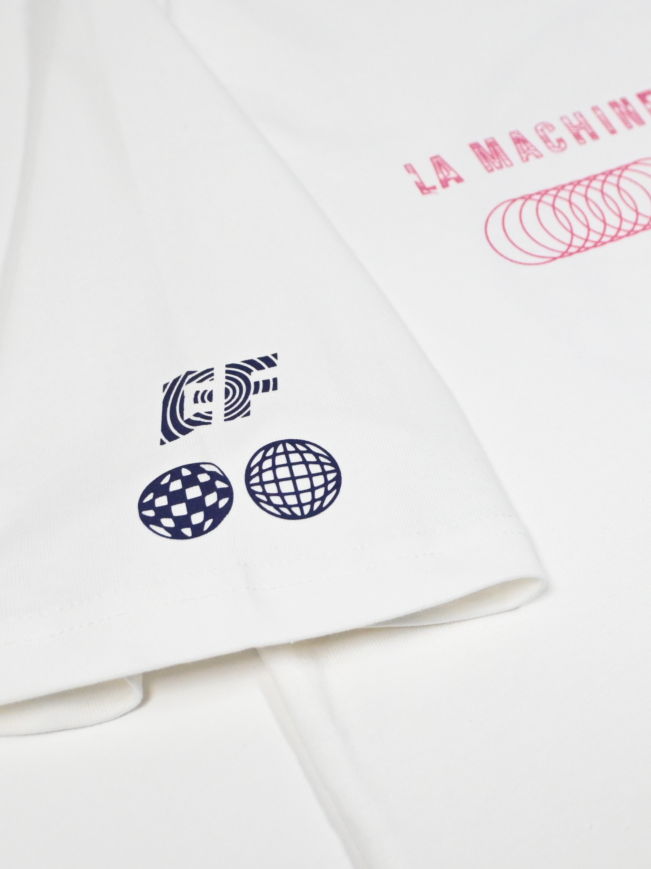 The La Machine X EF Pro Cycling - Globe T-shirt - Off White by La Machine Cycle Club, shown from another angle.