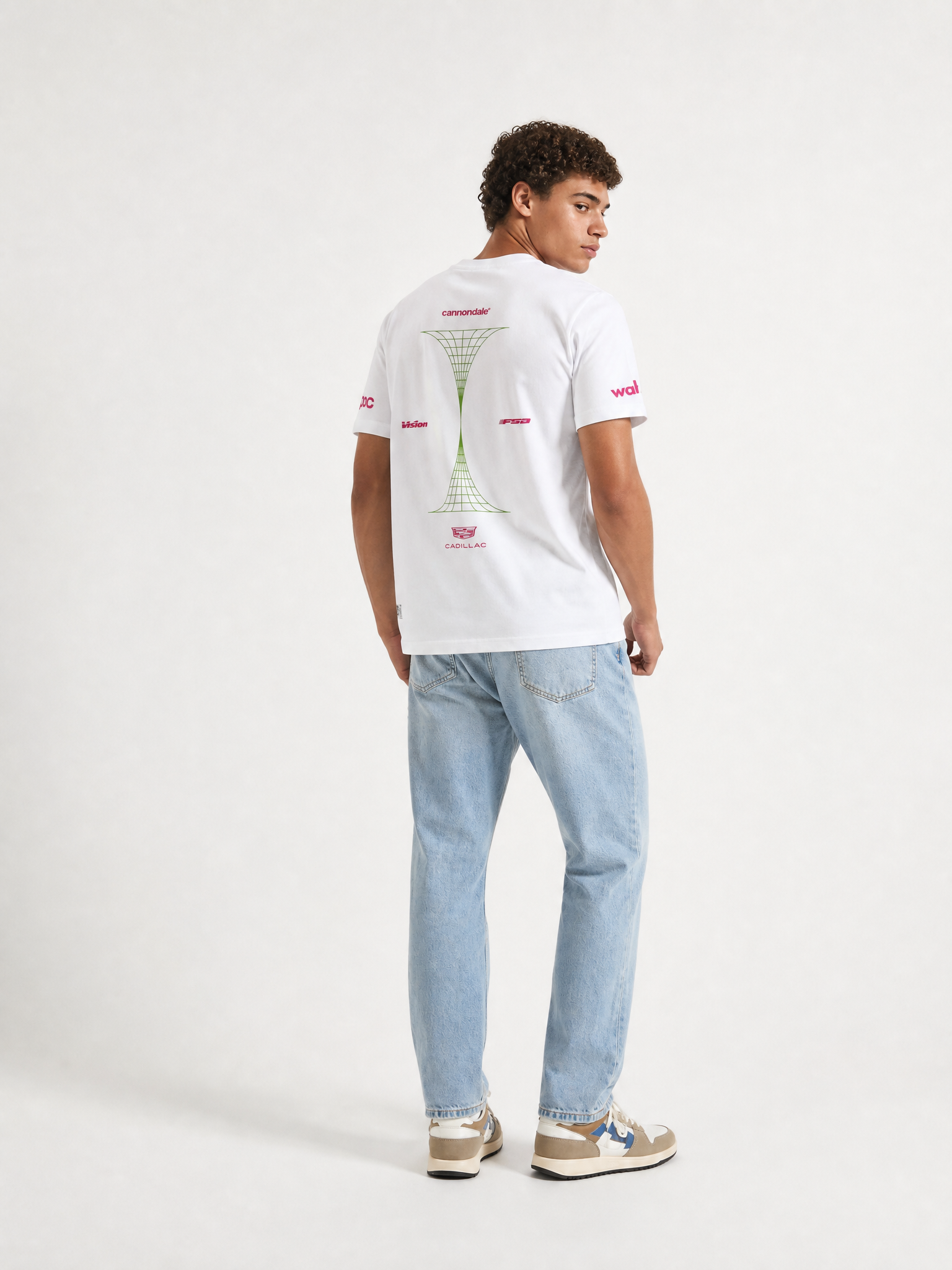 A model wearing the La Machine X EF Pro Cycling - Reverted T-shirt - White by La Machine Cycle Club.