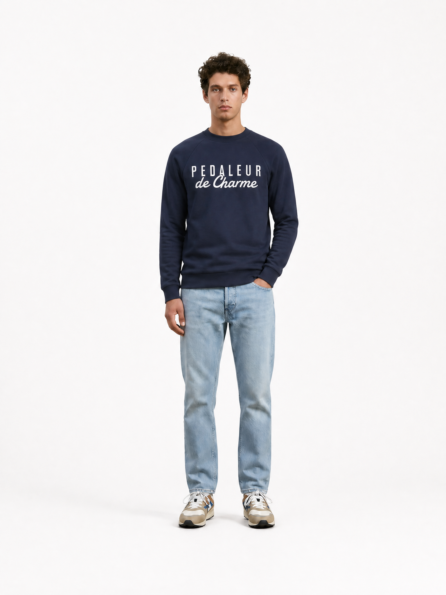 A model wearing the Pedaleur de Charme - Sweatshirt - Navy by La Machine Cycle Club.