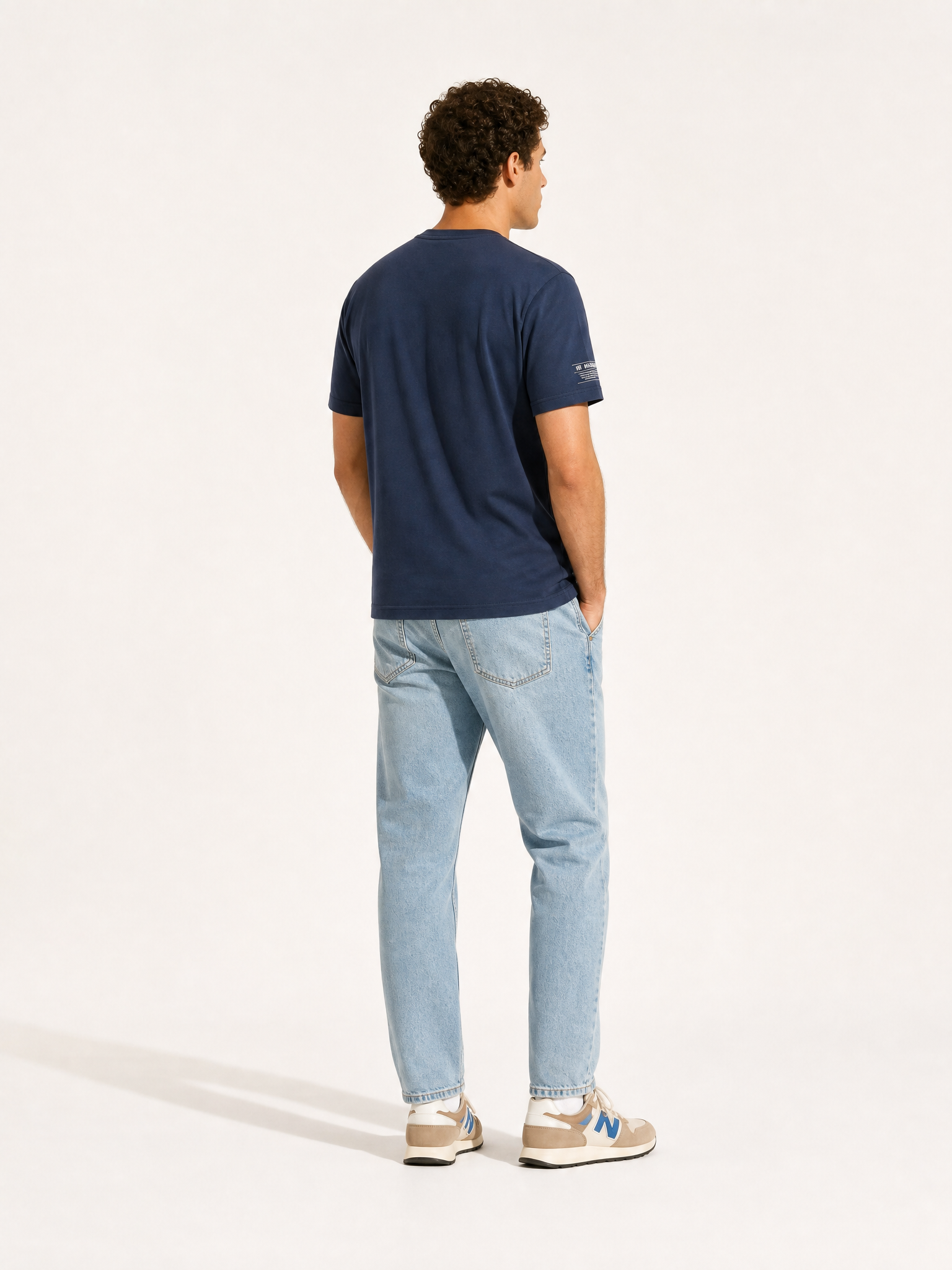 Back view of the Pedaleur de Charme - T-shirt - Navy by La Machine Cycle Club.