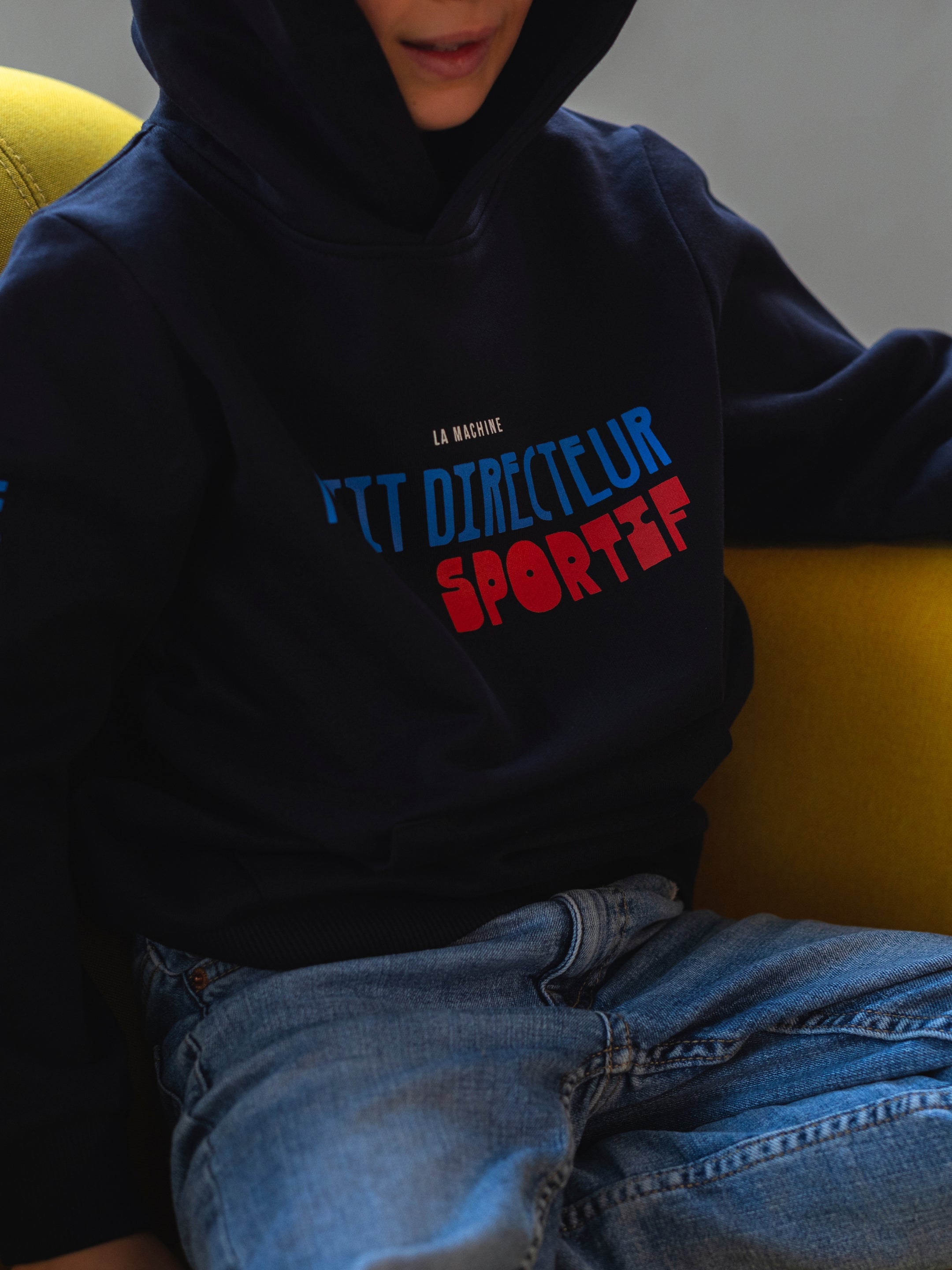 Detail view of the Petit - Petit Directeur Sportif - Hoodie by La Machine Cycle Club.