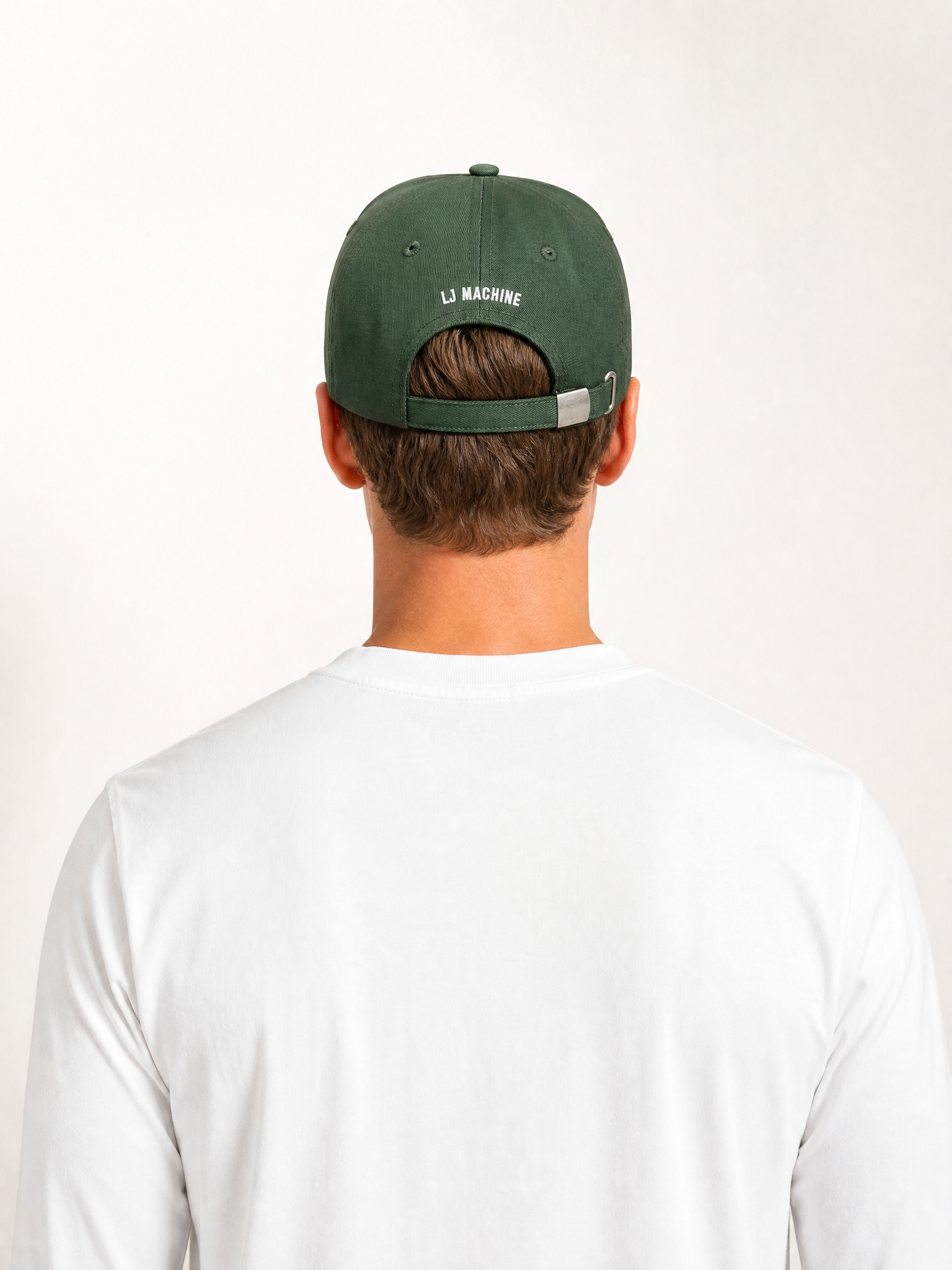 A model wearing the Suck at Skateboarding - Casual Cap by La Machine Cycle Club.